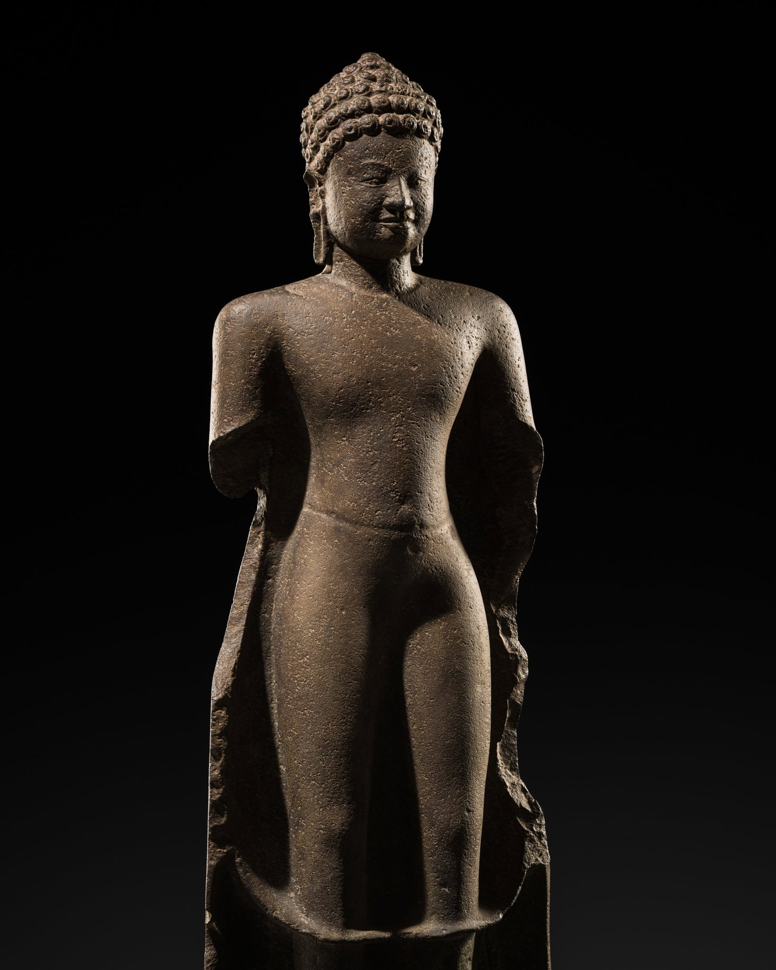 A SANDSTONE FIGURE OF BUDDHA SHAKYAMUNI, ANGKOR BOREI STYLE, PRE-ANGKOR PERIOD (1 of 13)