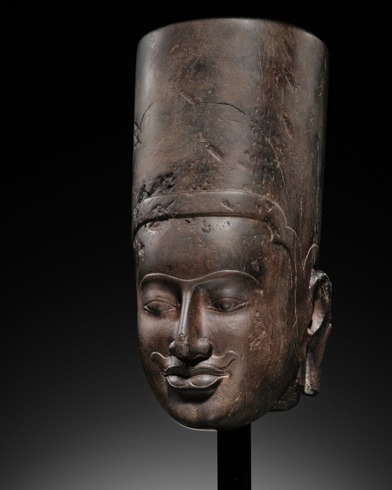 A SANDSTONE HEAD OF VISHNU, KULEN STYLE, PRE-ANGKOR PERIOD, FIRST HALF OF THE 9TH CENTURY (1 of 14)