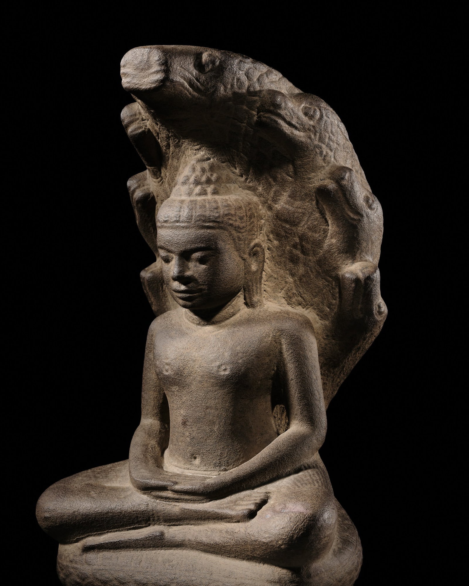 A KHMER SANDSTONE FIGURE OF BUDDHA MUCHALINDA, ANGKOR PERIOD, BAYON STYLE, 13TH CENTURY (1 of 15)