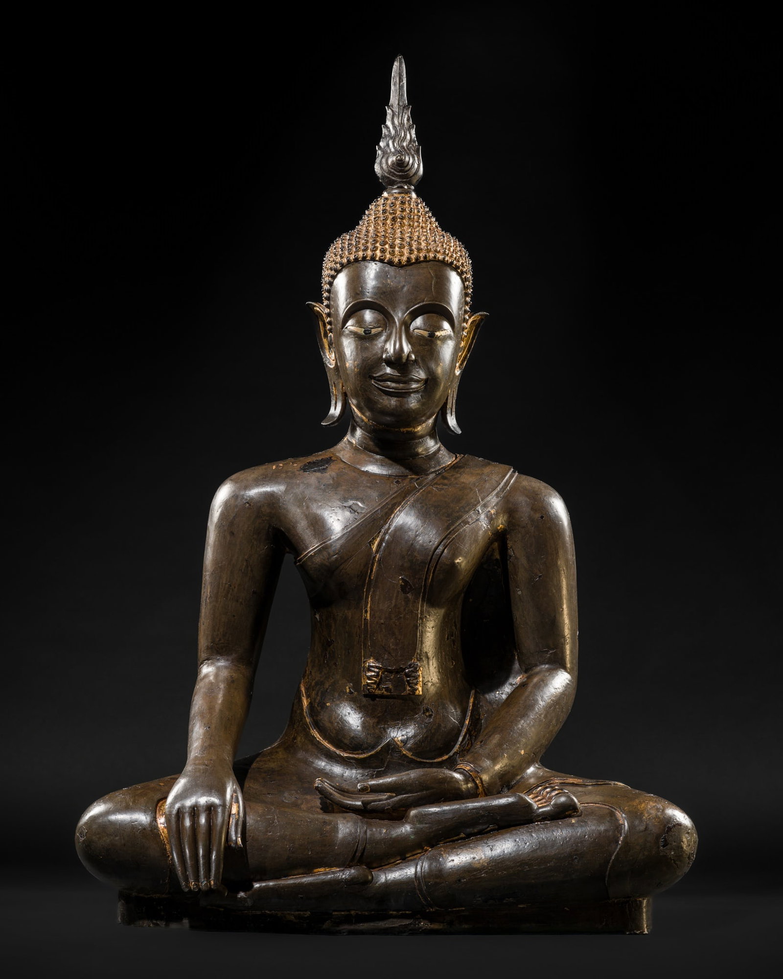 A LIFE-SIZE BRONZE FIGURE OF BUDDHA, AYUTTHAYA PERIOD, 16TH CENTURY: A LIFE-SIZE BRONZE FIGURE OF BUDDHA, AYUTTHAYA PERIOD, 16TH CENTURY Thailand. Finely cast seated in ardha padmasana on a short base, his right hand lowered in bhumisparsha mudra and the left held in d