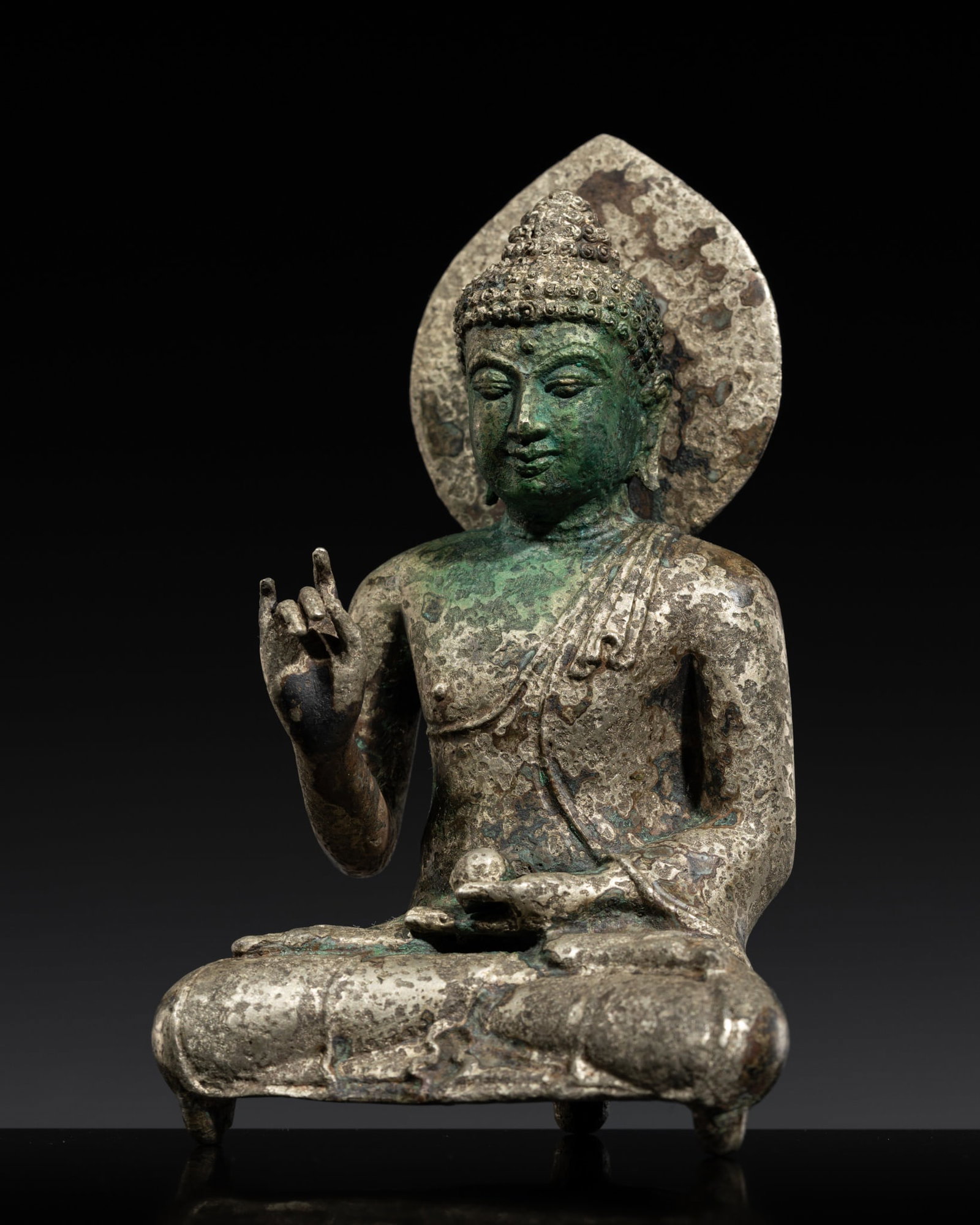 A SILVER AND COPPER ALLOY FIGURE OF THE VAIROCHANA BUDDHA, CENTRAL JAVA, SAILENDRA DYNASTY, 8TH-9TH (1 of 15)