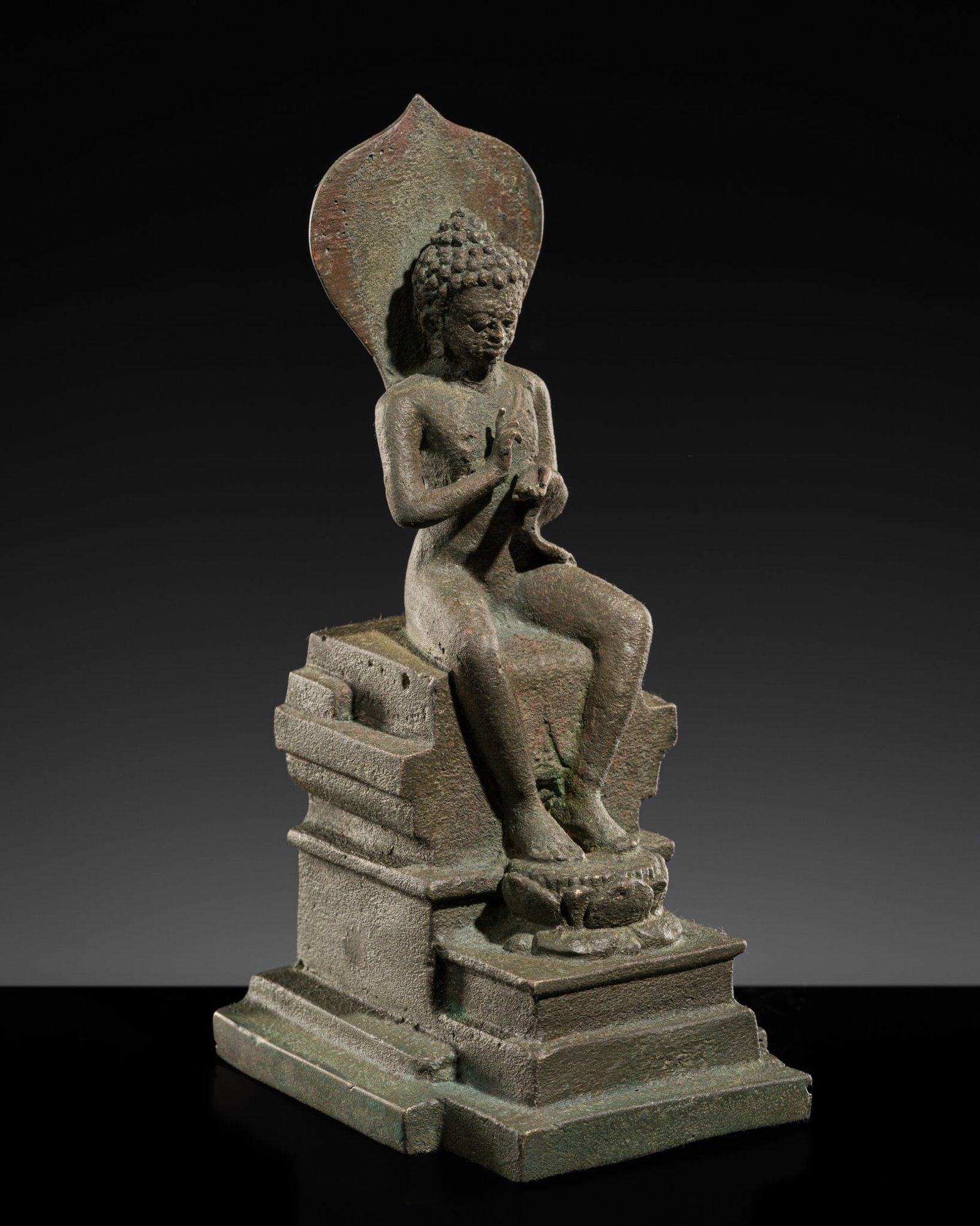 A FINE AND RARE BRONZE FIGURE OF THE ENTHRONED BUDDHA, CENTRAL JAVA, 9TH-10TH CENTURY (1 of 13)