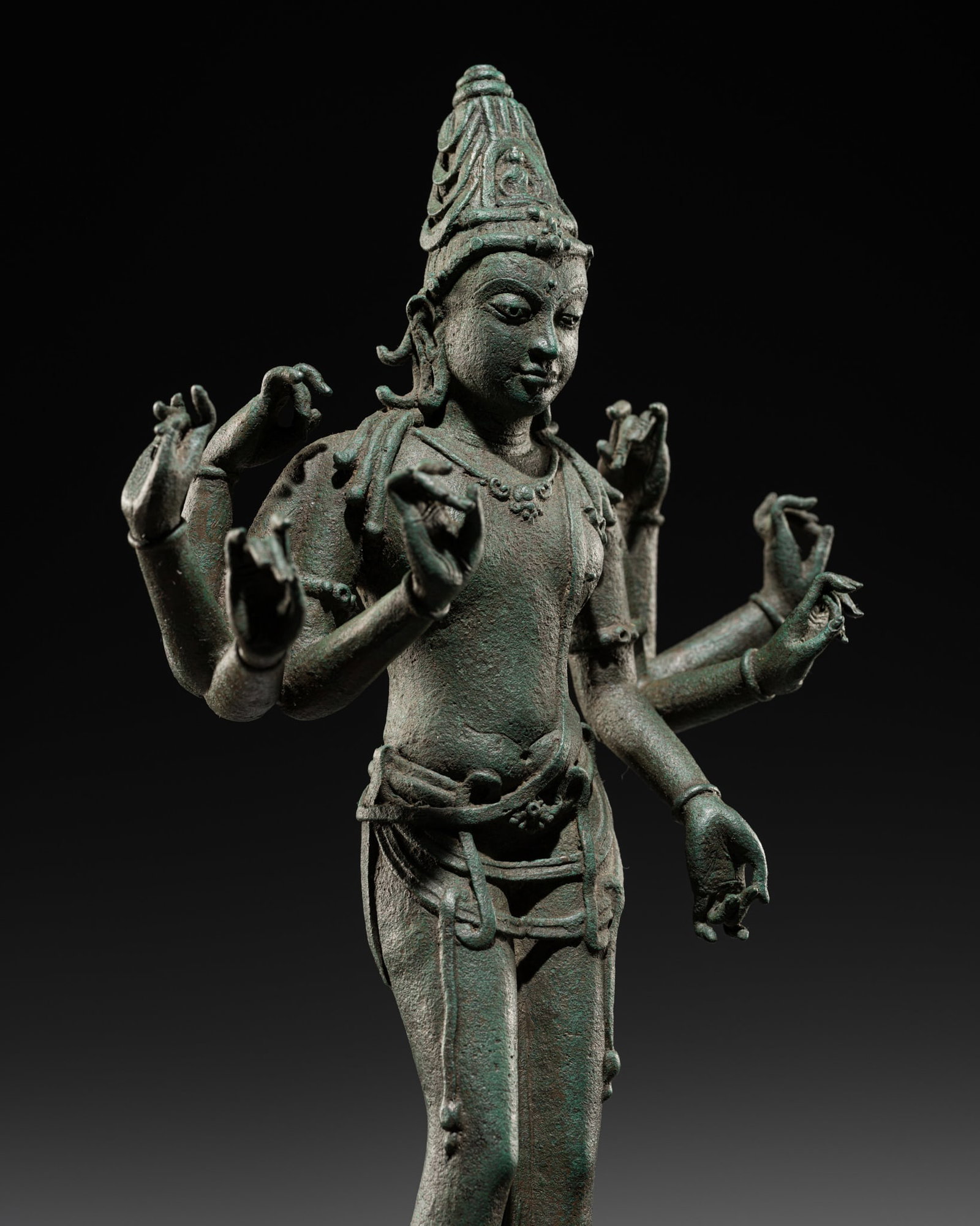 A LARGE BRONZE FIGURE OF AVALOKITESHVARA AMOGHAPASHA, CENTRAL JAVA, 9TH-13TH CENTURY: A LARGE BRONZE FIGURE OF AVALOKITESHVARA AMOGHAPASHA, CENTRAL JAVA, 9TH-13TH CENTURY Indonesia. Heavily cast, the eight-handed deity stands in samabhanga, the primary left hand lowered in abhaya mudra