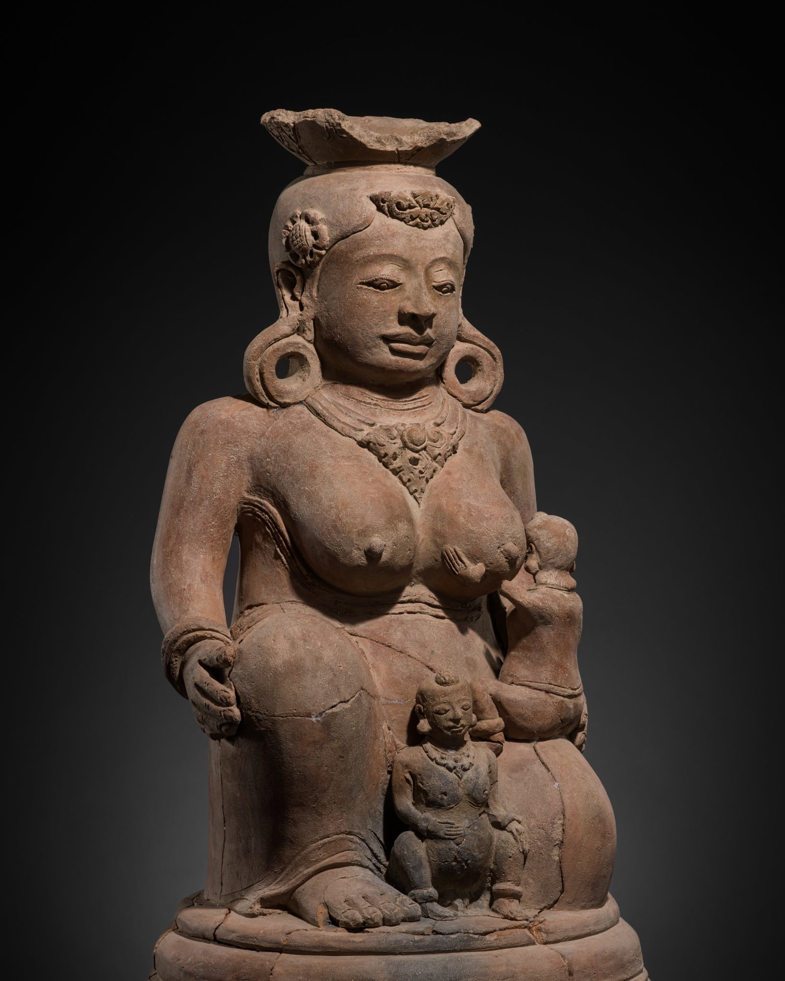 A MAJAPAHIT TERRACOTTA FIGURE OF MEN BRAJUT (HARITI) WITH CHILDREN (1 of 16)