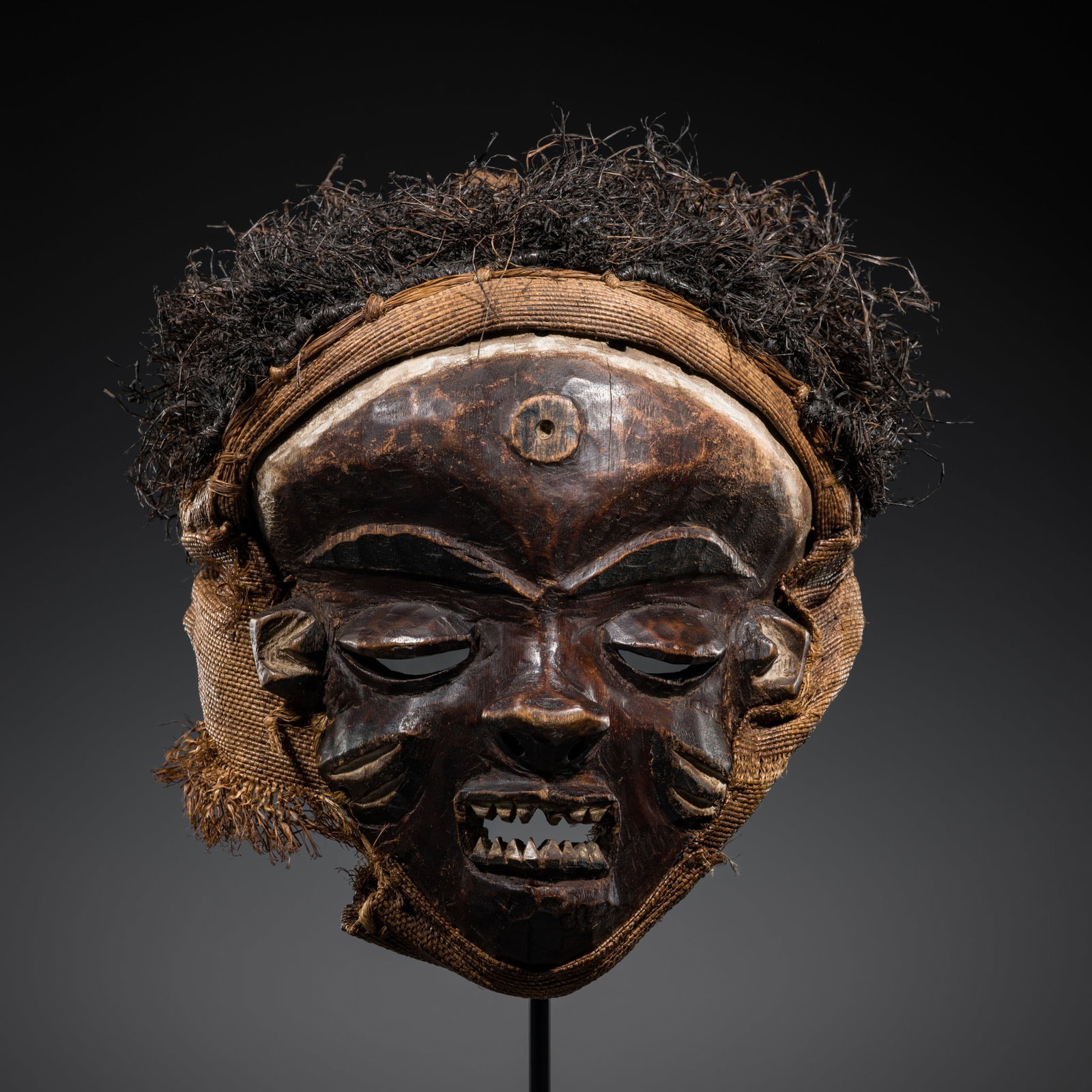 A PENDE PAINTED WOOD RITUAL MASK, MBUYA, FIRST HALF OF 20TH CENTURY: A PENDE PAINTED WOOD RITUAL MASK, MBUYA, FIRST HALF OF 20TH CENTURY External Expert Authentication: This lot was authenticated by Prof. Erwin Melchardt, who confirms the attribution and dating above. 