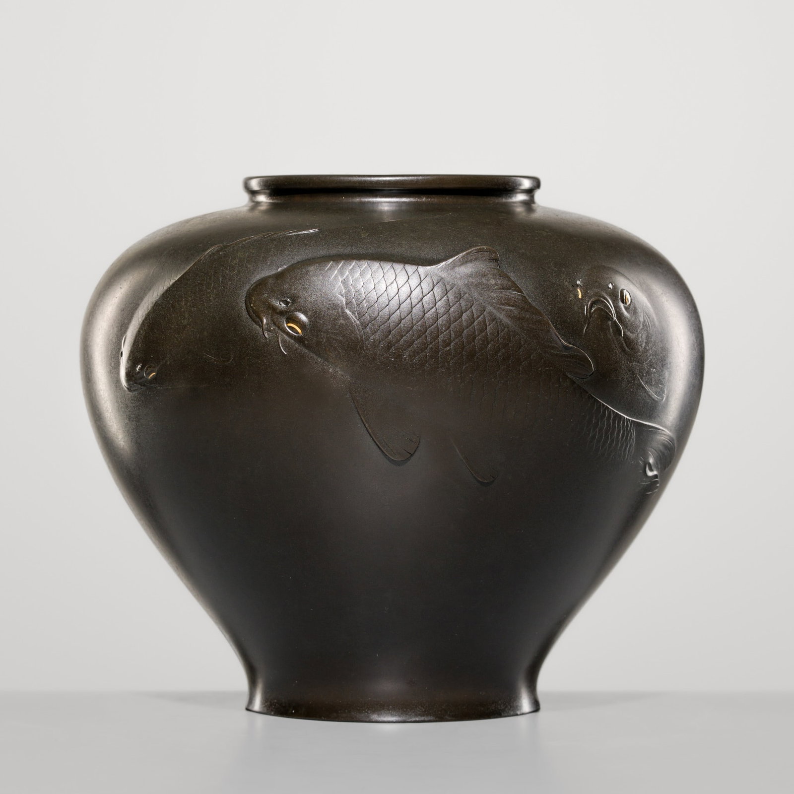 TAKAAKI: A LARGE BRONZE ‘CARPS’ VASE: TAKAAKI: A LARGE BRONZE ‘CARPS’ VASE By Takaaki, signed Takaaki Japan, early 20th century, Meiji (1868-1912) to Taisho period (1912-1926) Heavily cast, the globular body supported on a sh