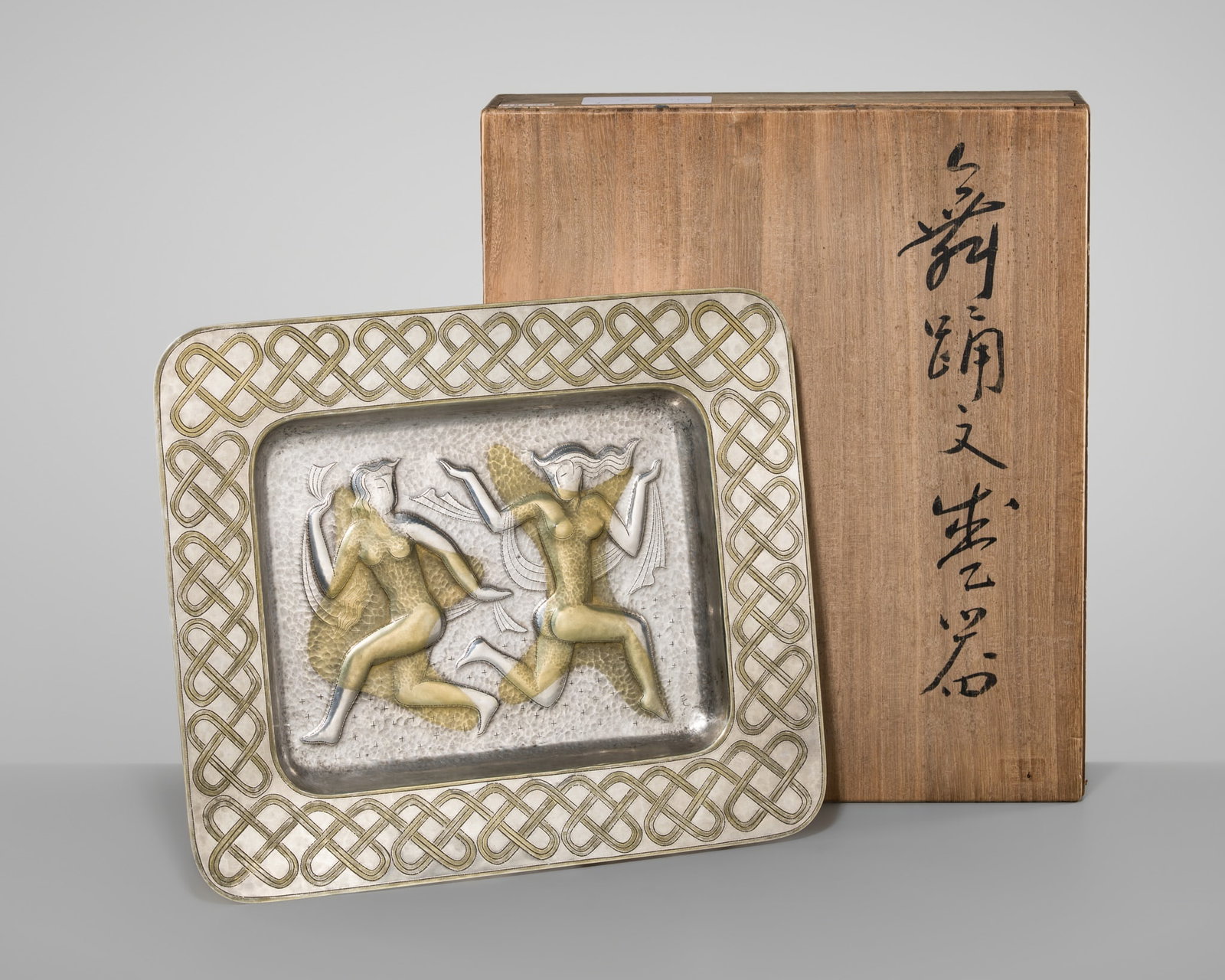 OTANI HARUHIKO: A FINE REPOUSSÉ SILVER TRAY WITH SHROUDED FEMALE FIGURES: OTANI HARUHIKO: A FINE REPOUSSÉ SILVER TRAY WITH SHROUDED FEMALE FIGURES Otani Haruhiko (1906–1981), signed and sealed to the tomobako Japan, 20th century, Showa period (1926–1989) Re