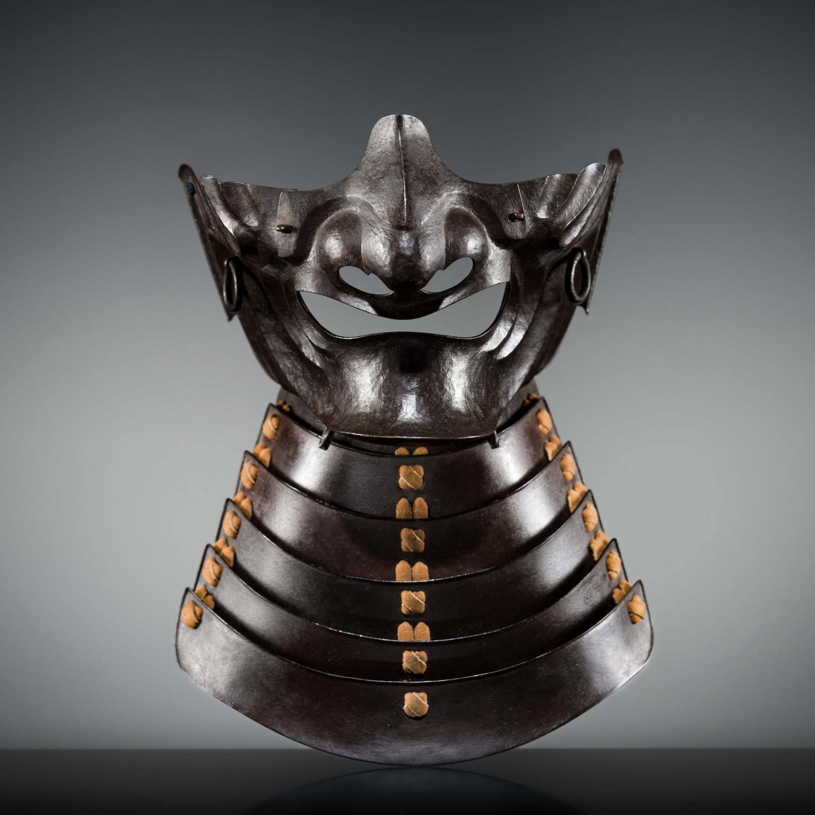 MYOCHIN MUNEHARU: A FINE MYOCHIN SCHOOL LACQUERED IRON MENPO (1 of 11)