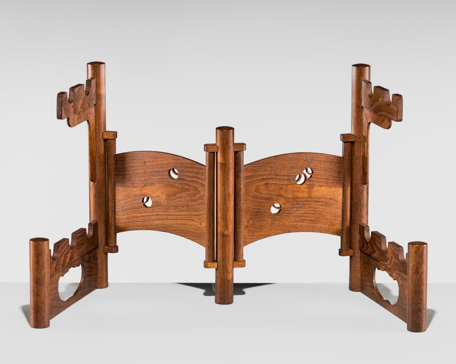 A WOOD KATANA-KAKE (SWORD STAND): A WOOD KATANA-KAKE (SWORD STAND) Japan, Meiji period (1868-1912) to Taisho period (1912-1926) The katana-kake supported on five tubular poles connected with smaller bars that rotate, joined by a pair 