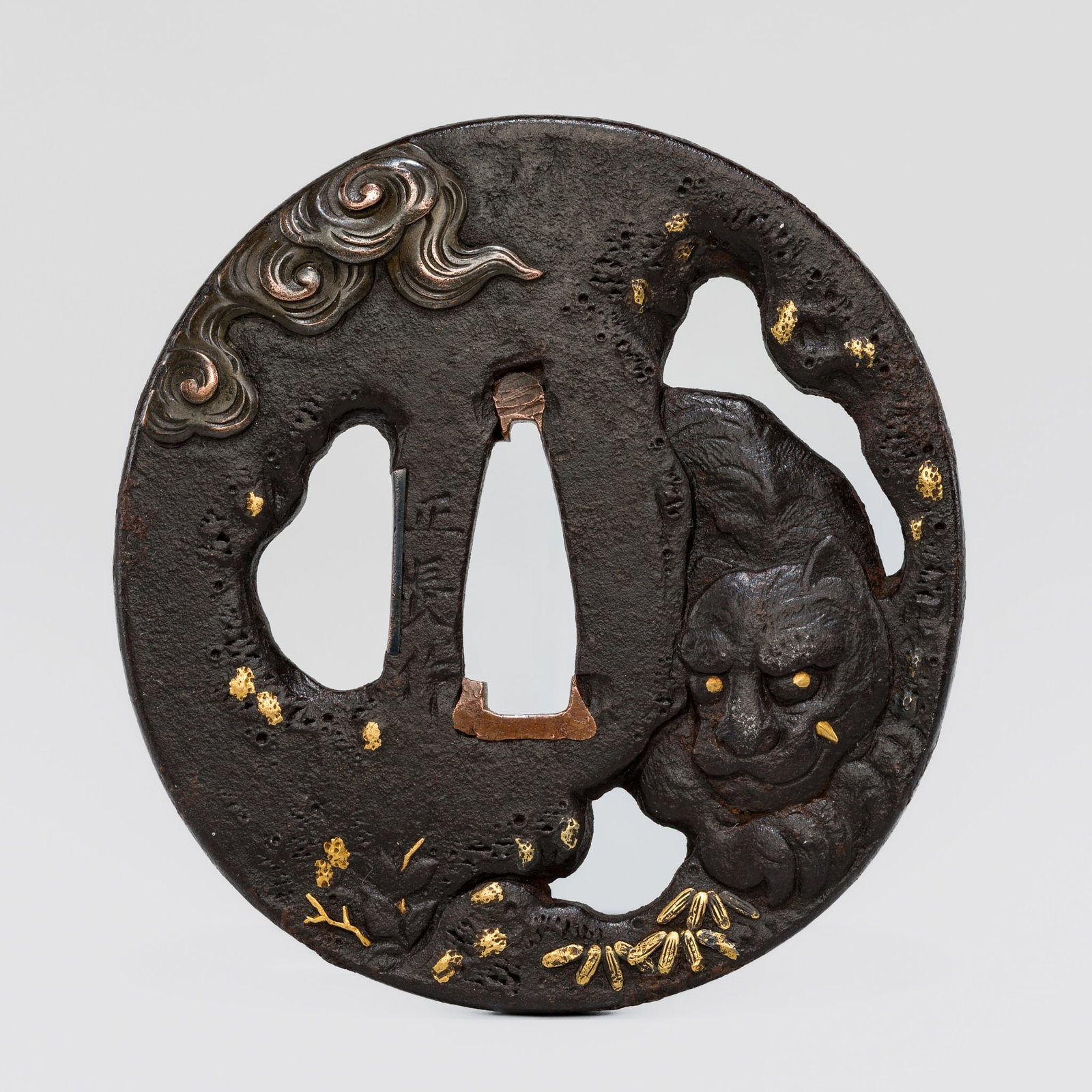 MASANAGA: A FINE IRON TSUBA WITH A TIGER IN A CAVE: MASANAGA: A FINE IRON TSUBA WITH A TIGER IN A CAVE By Masanaga, signed Masanaga saku Japan, 18th century, Edo period (1615-1868) Of nademarugata form, the kogai hitsu ana with shakudo sekigane and the