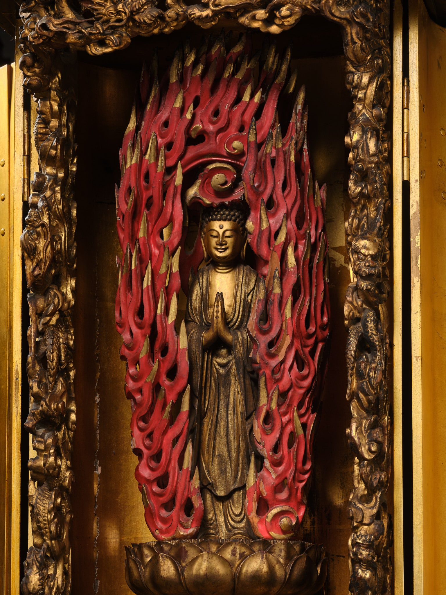 AN IMPRESSIVE LARGE GILT-LACQUERED ZUSHI (PORTABLE BUDDHIST SHRINE) OF AMIDA, EDO PERIOD: AN IMPRESSIVE LARGE GILT-LACQUERED ZUSHI (PORTABLE BUDDHIST SHRINE) OF AMIDA, EDO PERIOD Japan, 18th-19th century, Edo period (1615-1868) The slender shrine of roiro with hinged doors and gilt-m
