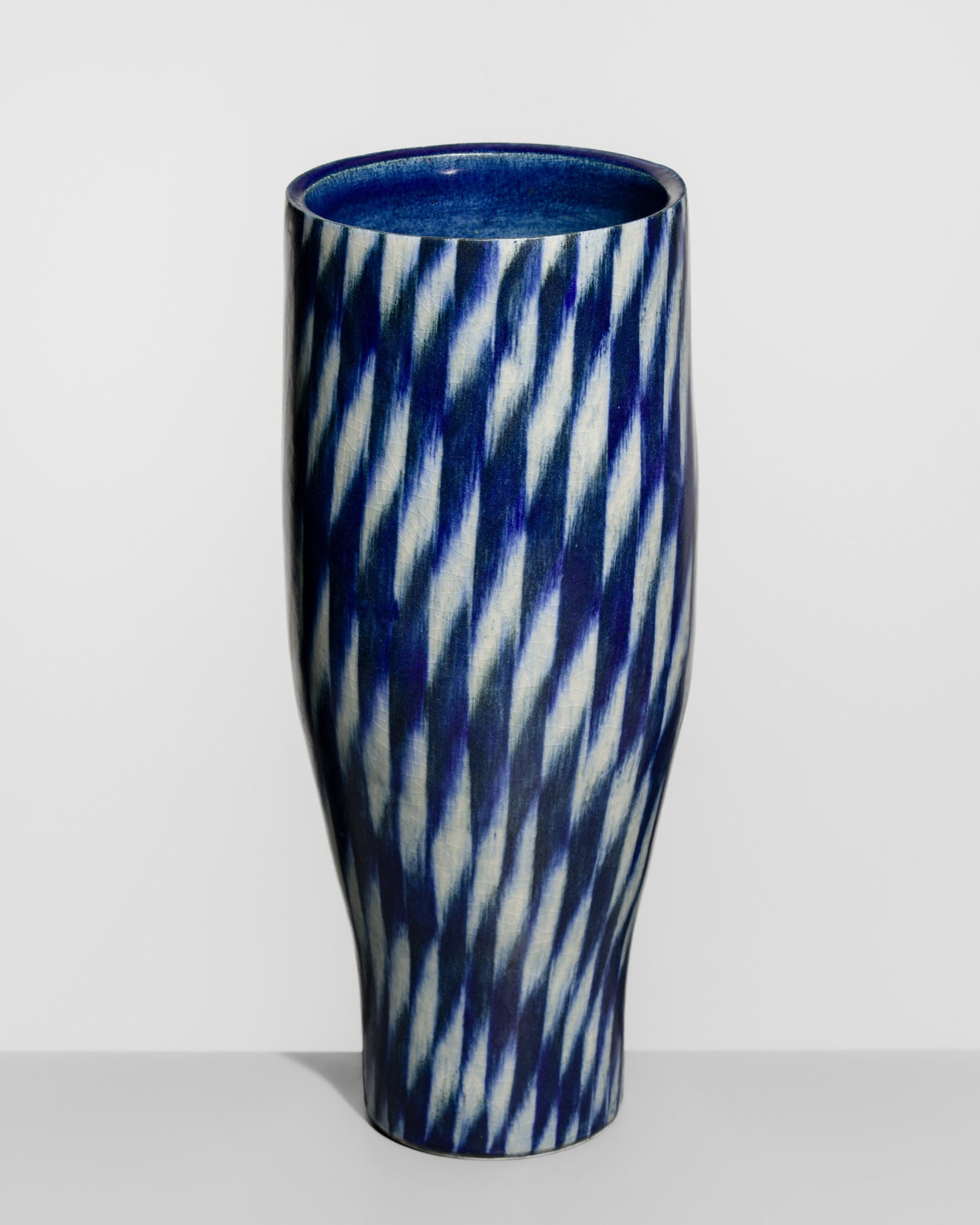 FUKUSHIMA HIROKO: A LARGE BLUE- AND WHITE-CHECKERED PORCELAIN VASE: FUKUSHIMA HIROKO: A LARGE BLUE- AND WHITE-CHECKERED PORCELAIN VASE By Fukushima Hiroko, signed by the artist Japan, Heisei period (1989-2019) Finely potted, the tall cylindrical body subtly narrowing 
