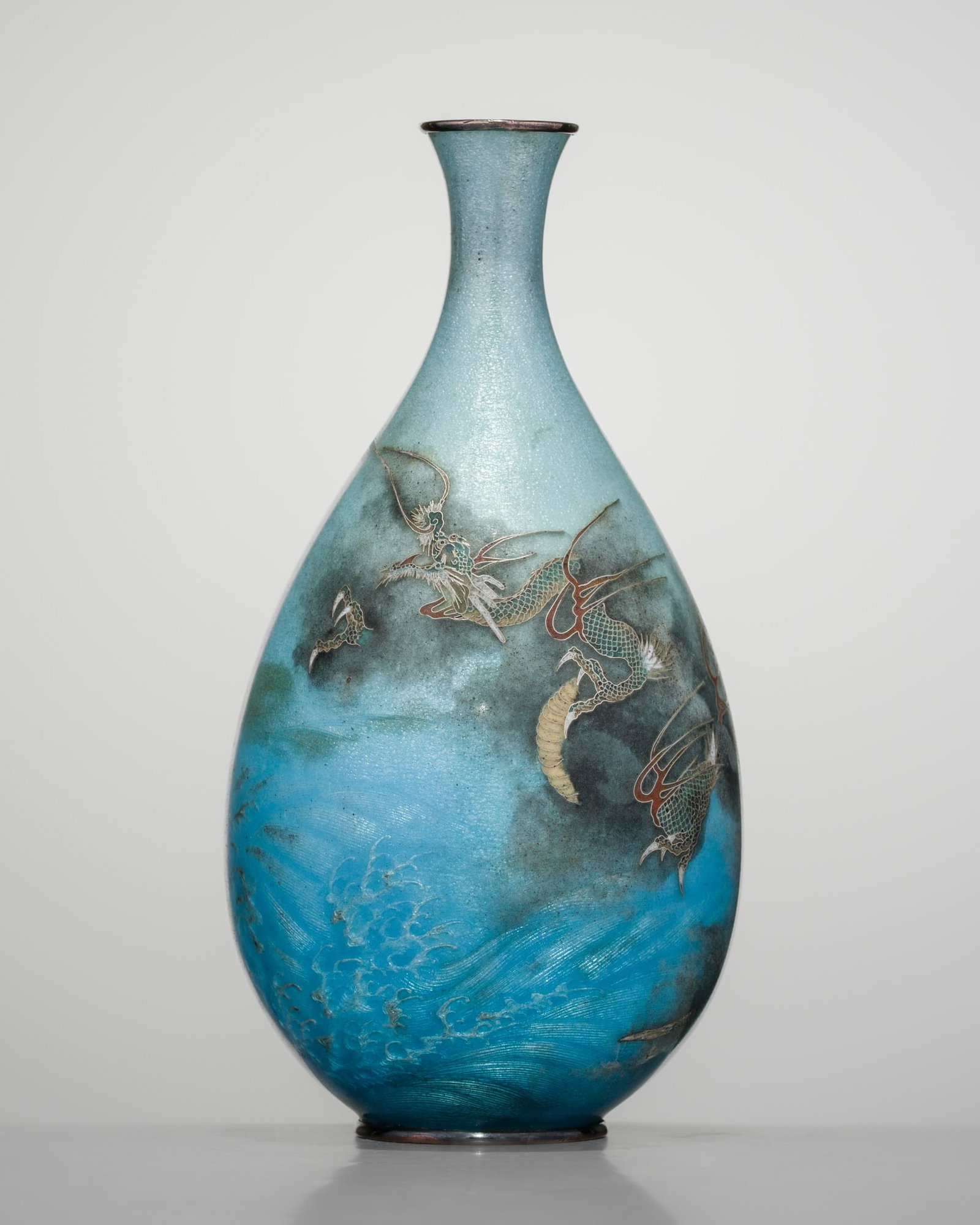 KUMENO TEITARO: A FINE GINBARI CLOISONNÉ ‘DRAGON AND WAVES’ VASE: KUMENO TEITARO: A FINE GINBARI CLOISONNÉ ‘DRAGON AND WAVES’ VASE By the Kumeno Teitaro Workshop, sealed Kume and signed Kumeno zo Japan, Meiji period (1868-1912) Of ovoid form, raised