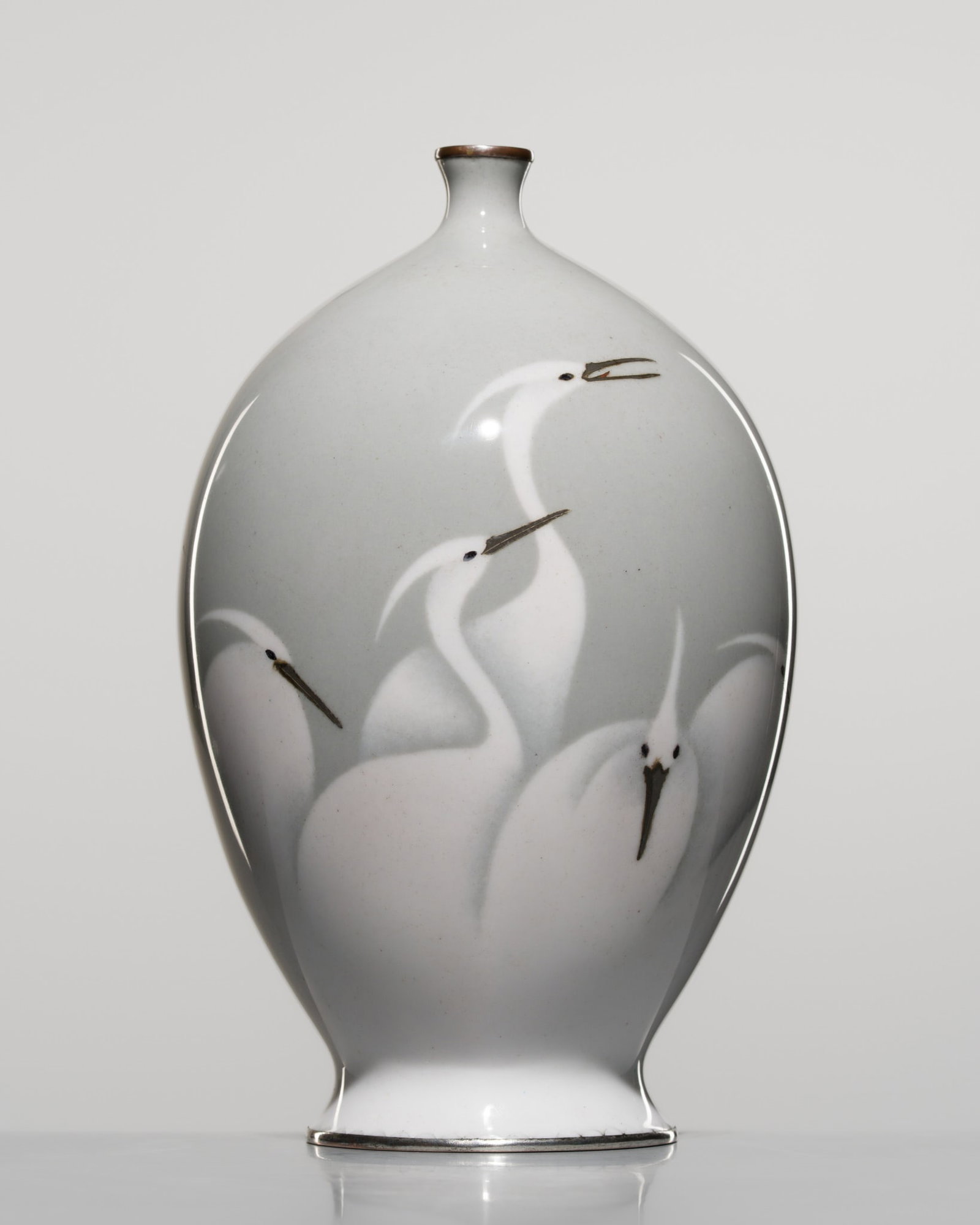 A FINE MUSEN (WIRELESS) CLOISONNÉ ENAMEL ‘SNOWY WHITE EGRETS’ VASE: A FINE MUSEN (WIRELESS) CLOISONNÉ ENAMEL ‘SNOWY WHITE EGRETS’ VASE Japan, Meiji period (1868–1912) The globular body gently tapering toward a spreading foot and rising to a shor
