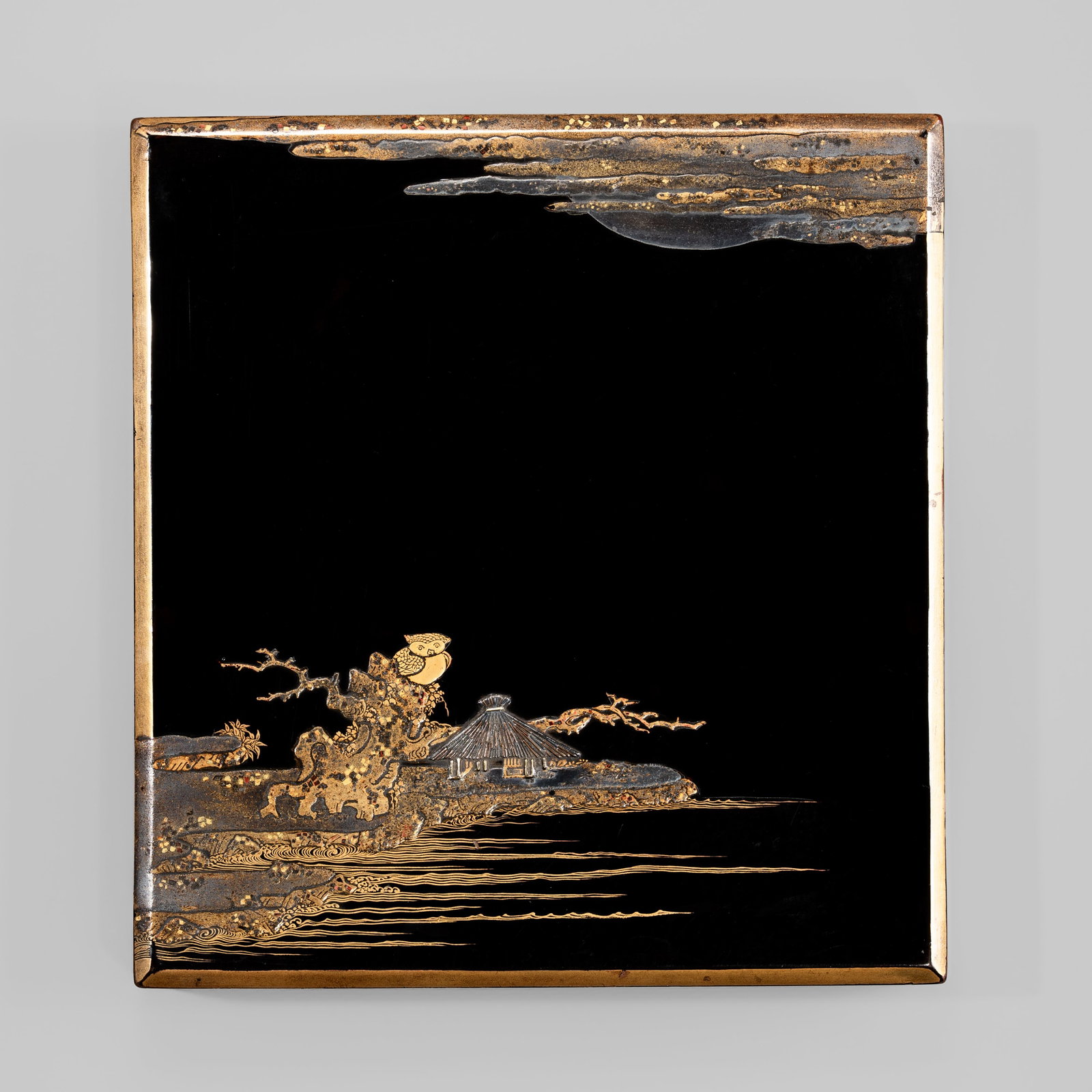 A FINE LACQUER SUZURIBAKO (WRITING BOX) AND COVER DEPICTING AN OWL AND MOON: A FINE LACQUER SUZURIBAKO (WRITING BOX) AND COVER DEPICTING AN OWL AND MOON Japan, c. 1700-1750, Edo period (1615-1868) Of rectangular form with canted edges, bearing a lustrous roiro ground finely de