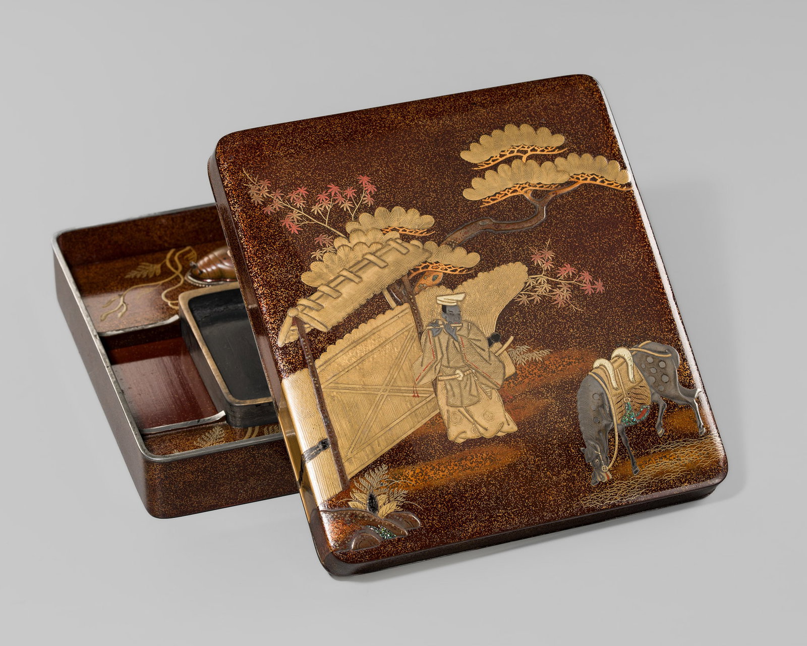A FINE INLAID LACQUER ‘MINAMOTO NO NAKAKUNI PLAYING THE FLUTE’ SUZURIBAKO (WRITING BOX): A FINE INLAID LACQUER ‘MINAMOTO NO NAKAKUNI PLAYING THE FLUTE’ SUZURIBAKO (WRITING BOX) Japan, 18th-19th century, Edo period (1615-1868) Of rectangular form with rounded edges, finely deco