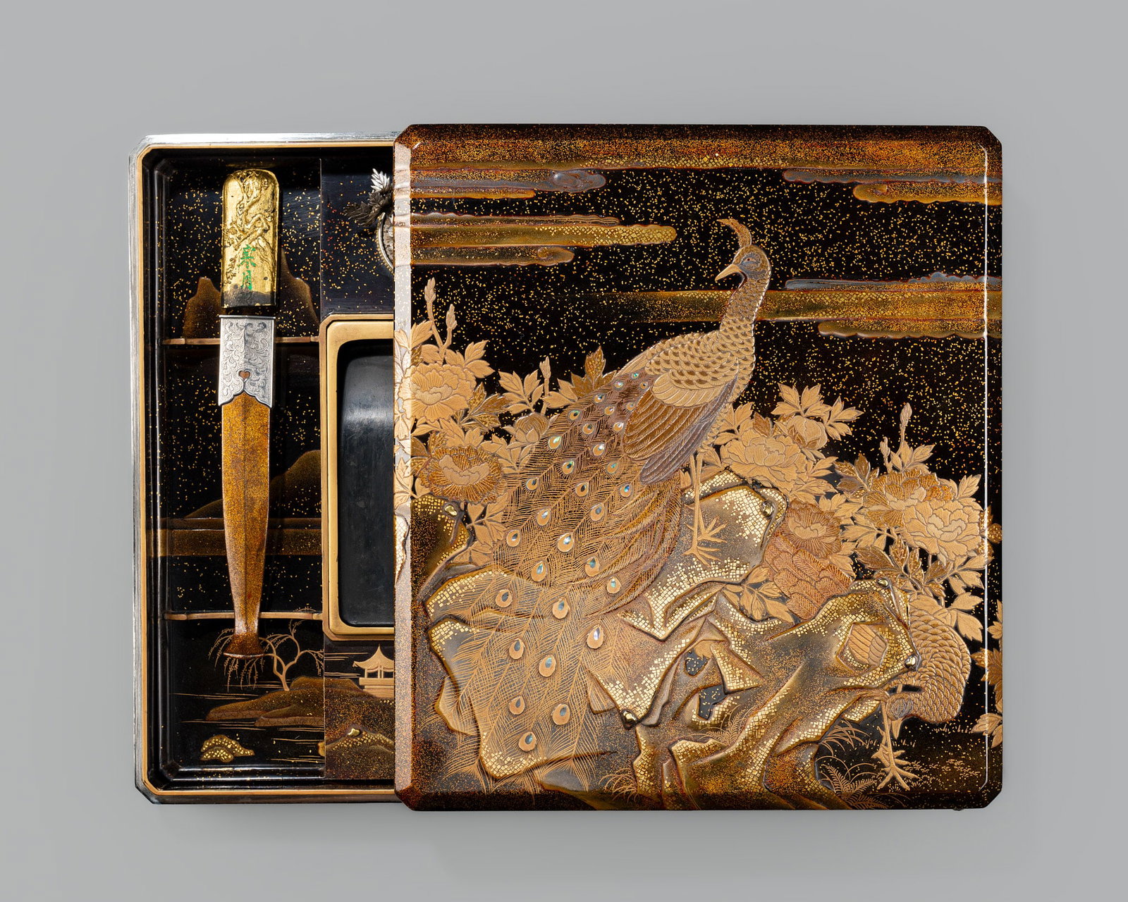A FINE INLAID LACQUER ‘PEACOCK AND PEAHEN’ SUZURIBAKO (WRITING BOX): A FINE INLAID LACQUER ‘PEACOCK AND PEAHEN’ SUZURIBAKO (WRITING BOX) Japan, 18th-19th century, Edo period (1615-1868) Of rectangular form with canted edges, bearing a lustrous roiro g