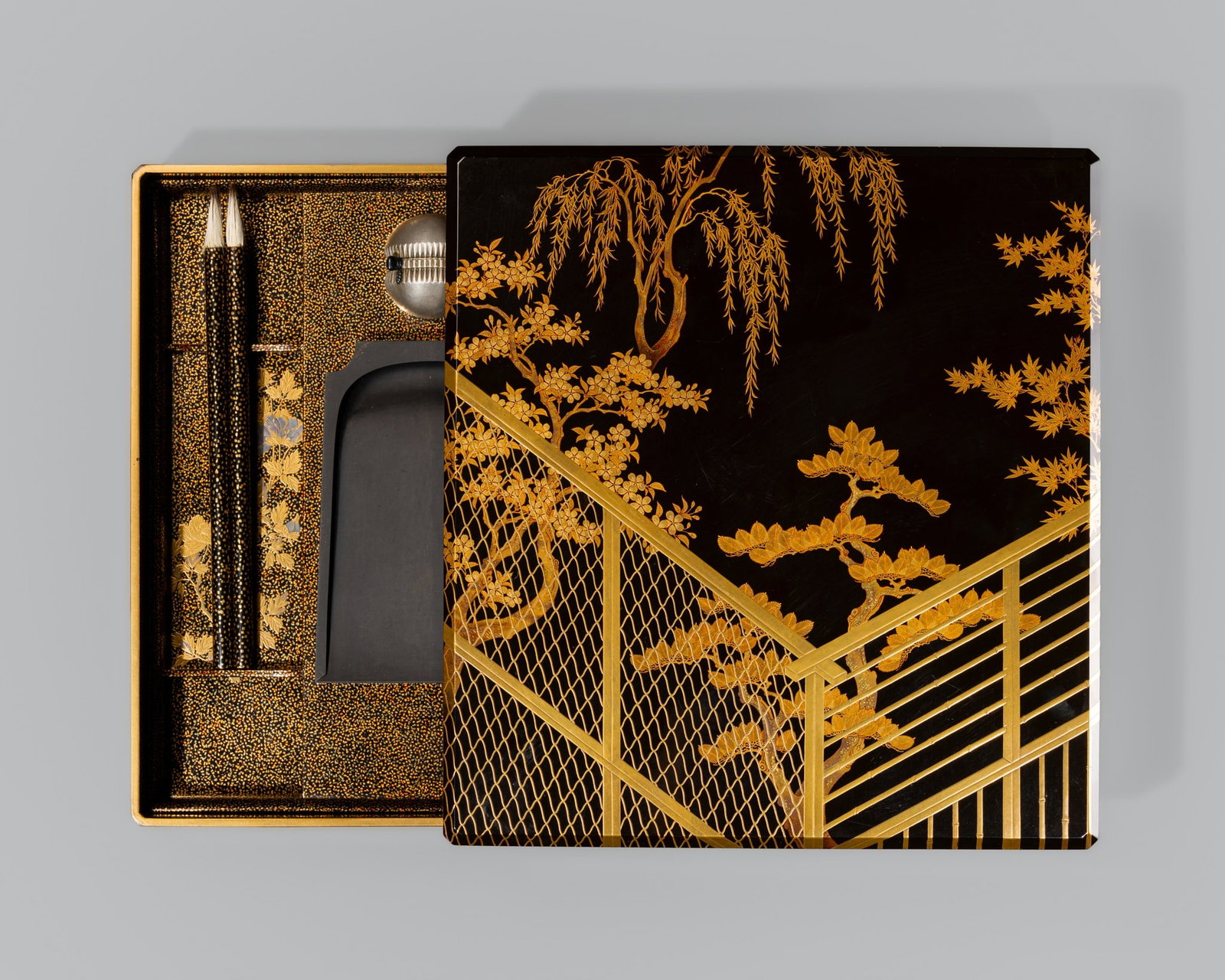 A FINE LACQUER ‘WAKANA’ SUZURIBAKO (WRITING BOX) AND COVER, DEPICTING THE THIRD: A FINE LACQUER ‘WAKANA’ SUZURIBAKO (WRITING BOX) AND COVER, DEPICTING THE THIRD PRINCESS’S CAT FROM THE TALE OF GENJI Japan, 18th century, Edo period (1615-1868) Of rectangular form 