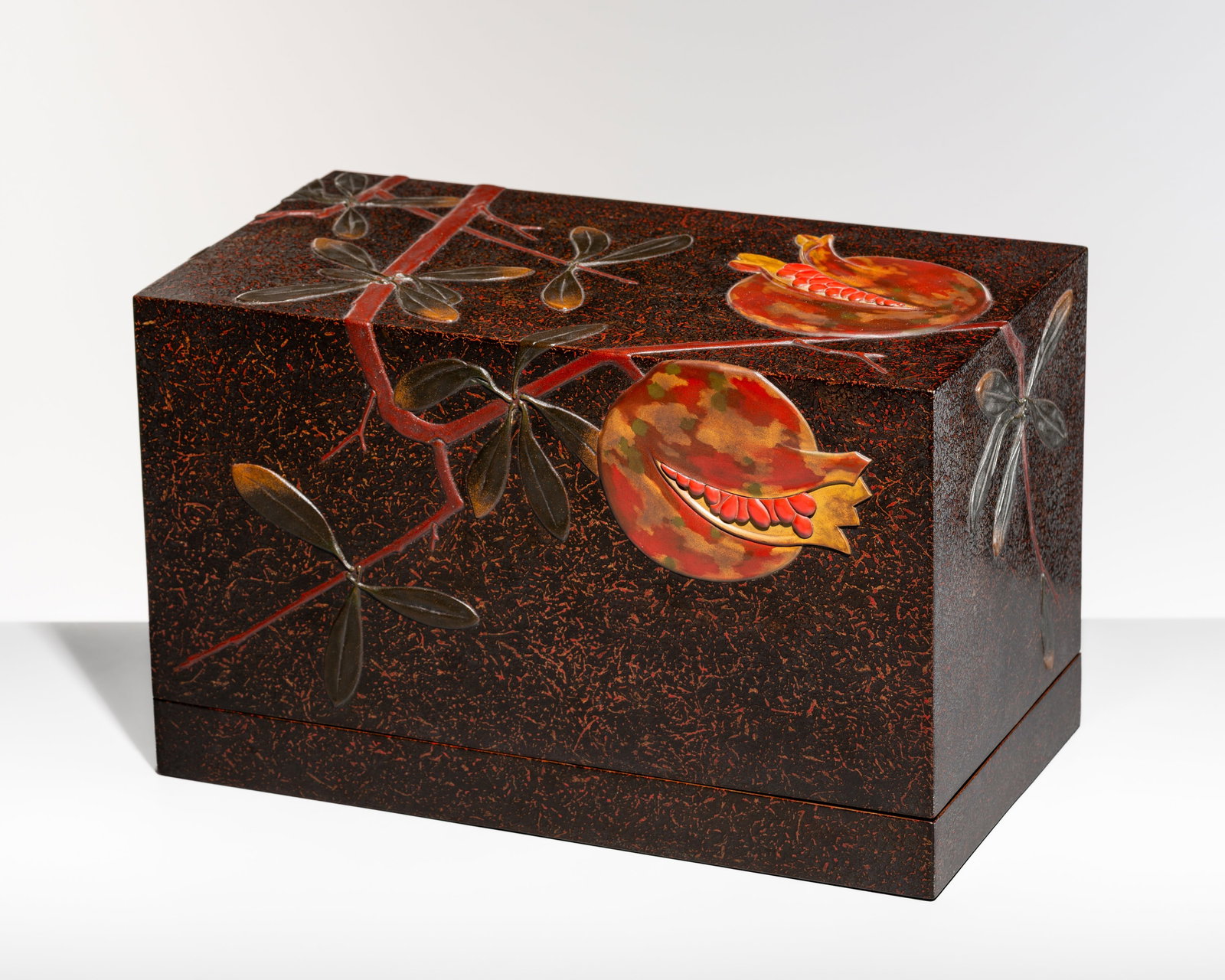 KAZUO: A LARGE LACQUER ‘POMEGRANATE’ STACKED BOX WITH INTEGRATED SUZURIBAKO (WRITING: KAZUO: A LARGE LACQUER ‘POMEGRANATE’ STACKED BOX WITH INTEGRATED SUZURIBAKO (WRITING BOX) By Kazuo, signed to the tomobako Japan, Showa period (1926–1989) Finely crafted in rectangul