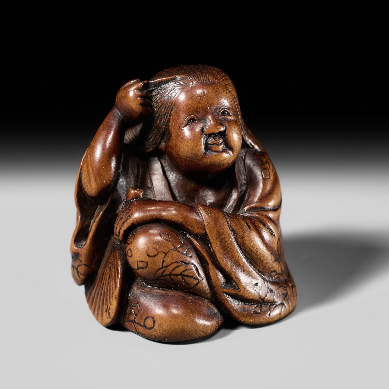 ISSAI: A FINE NAGOYA SCHOOL WOOD NETSUKE OF OKAME BRUSHING HER HAIR (1 of 13)