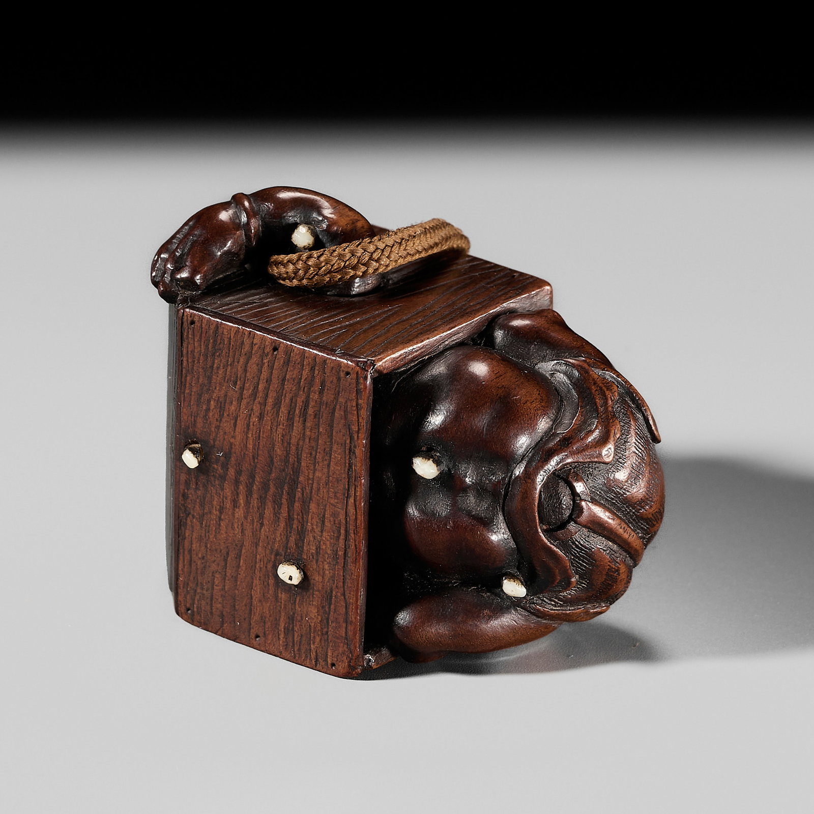 MASAMITSU: A HUMOROUS INLAID WOOD NETSUKE OF AN ONI DURING SETSUBUN (1 of 15)