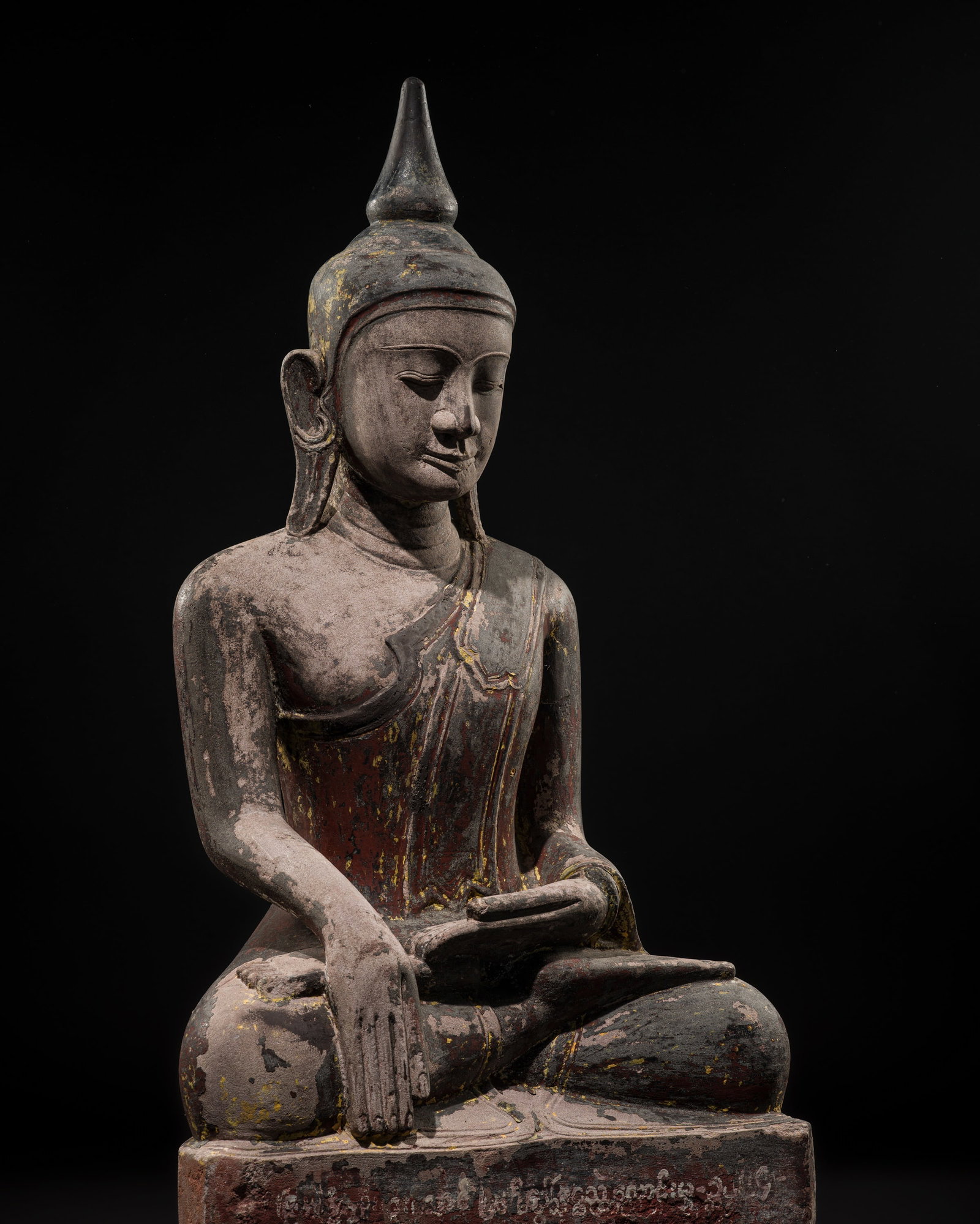 A RARE AND LARGE INSCRIBED LACQUERED STONE FIGURE OF BUDDHA SHAKYAMUNI, SHAN STATES, 17TH CENTURY: A RARE AND LARGE INSCRIBED LACQUERED STONE FIGURE OF BUDDHA SHAKYAMUNI, SHAN STATES, 17TH CENTURY This lot is from a single owner collection and is therefore offered without reserve The Jorgen Ruben G