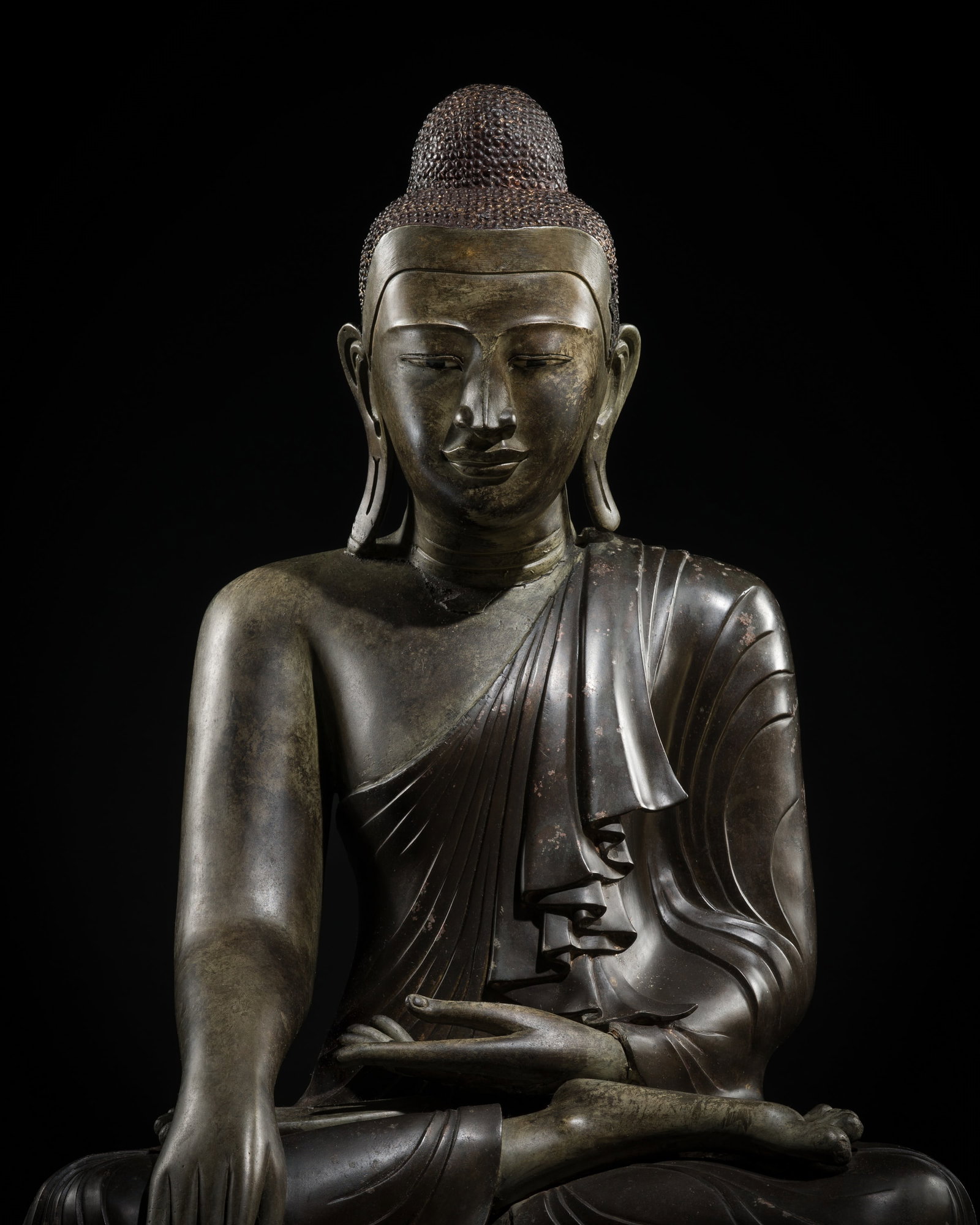 A FINE INSCRIBED LACQUERED BRONZE STATUE OF BUDDHA SHAKYAMUNI, KONBAUNG DYNASTY, 18TH CENTURY: A FINE INSCRIBED LACQUERED BRONZE STATUE OF BUDDHA SHAKYAMUNI, KONBAUNG DYNASTY, 18TH CENTURY This lot is from a single owner collection and is therefore offered without reserve Expert's note: The pre