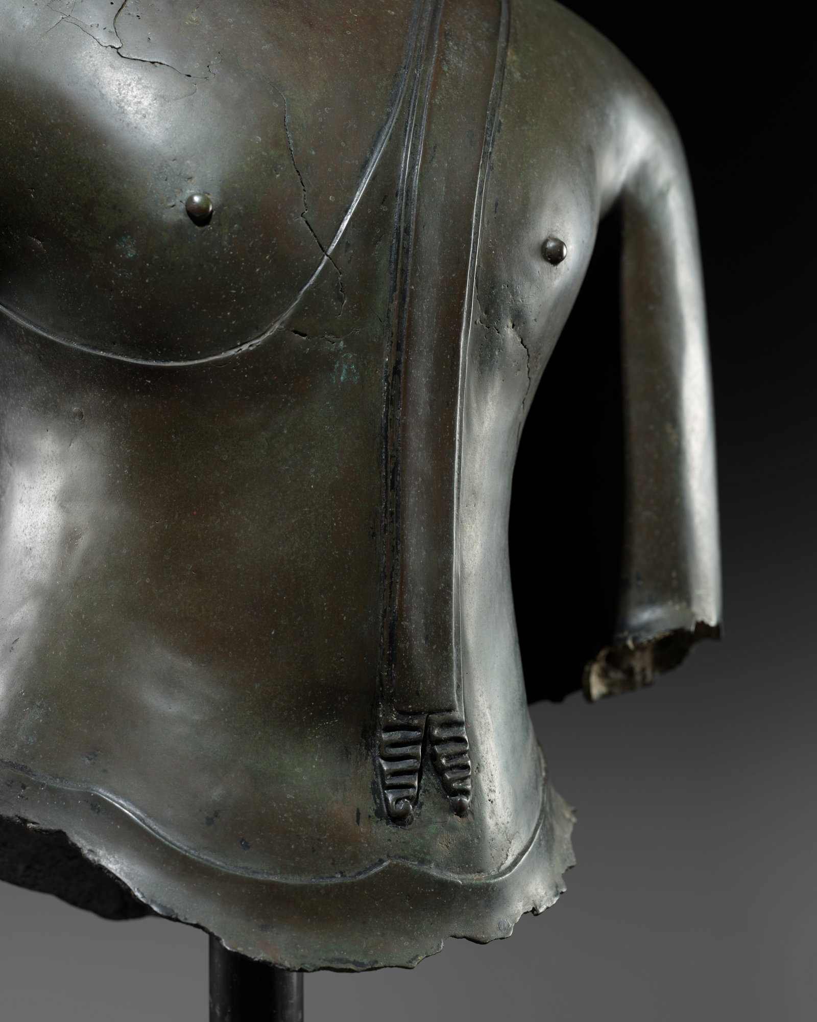 A BRONZE TORSO OF BUDDHA, SUKHOTHAI KINGDOM, 13TH-14TH CENTURY: A BRONZE TORSO OF BUDDHA, SUKHOTHAI KINGDOM, 13TH-14TH CENTURY This lot is from a single owner collection and is therefore offered without reserve The Jorgen Ruben Gallery Ledger, entry from 2005: 