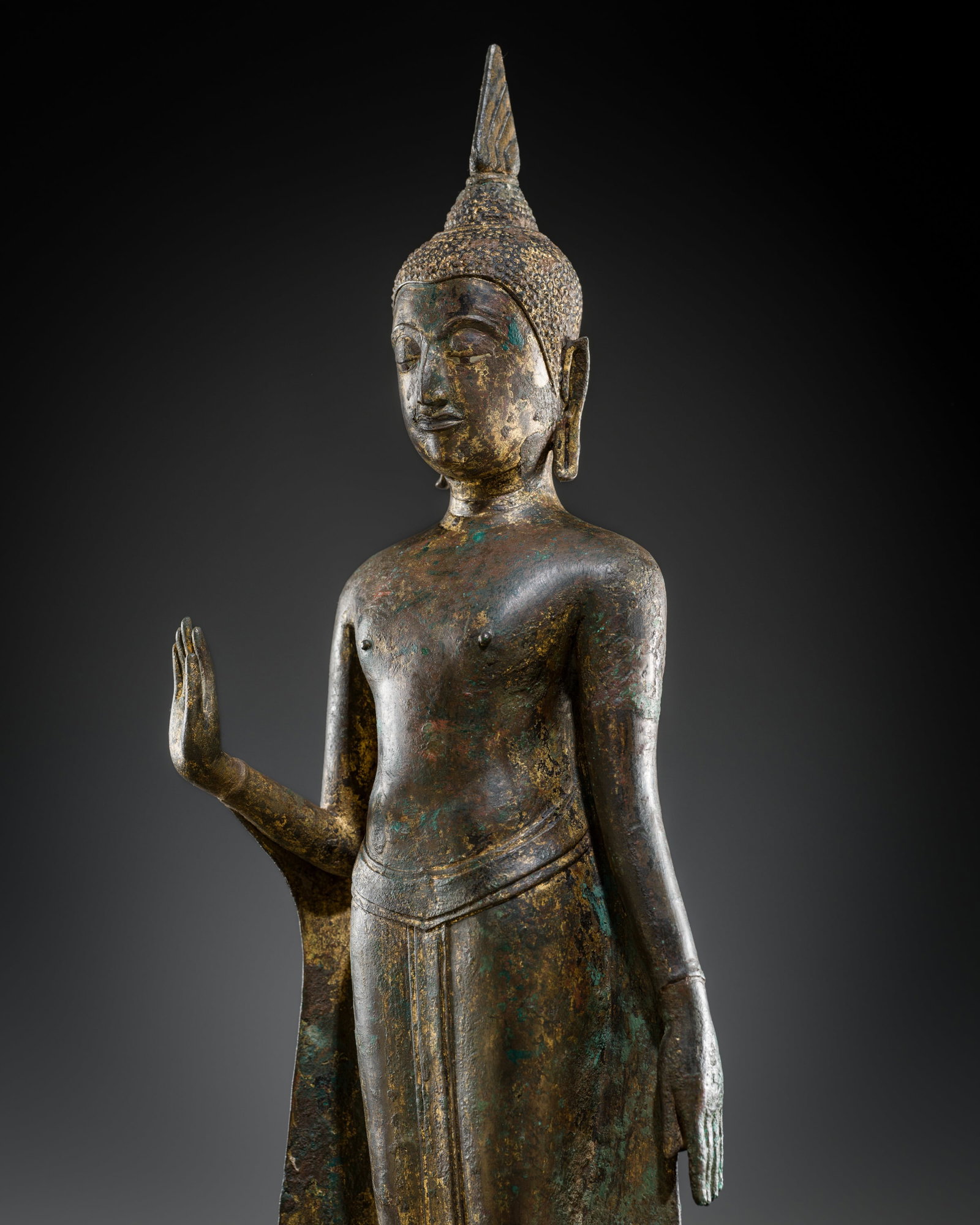 A GILT-BRONZE FIGURE OF BUDDHA, KAMPHAENG PHET STYLE, SUKTHOTHAI PERIOD, 15TH CENTURY: A GILT-BRONZE FIGURE OF BUDDHA, KAMPHAENG PHET STYLE, SUKTHOTHAI PERIOD, 15TH CENTURY This lot is from a single owner collection and is therefore offered without reserve The Jorgen Ruben Gallery Ledge