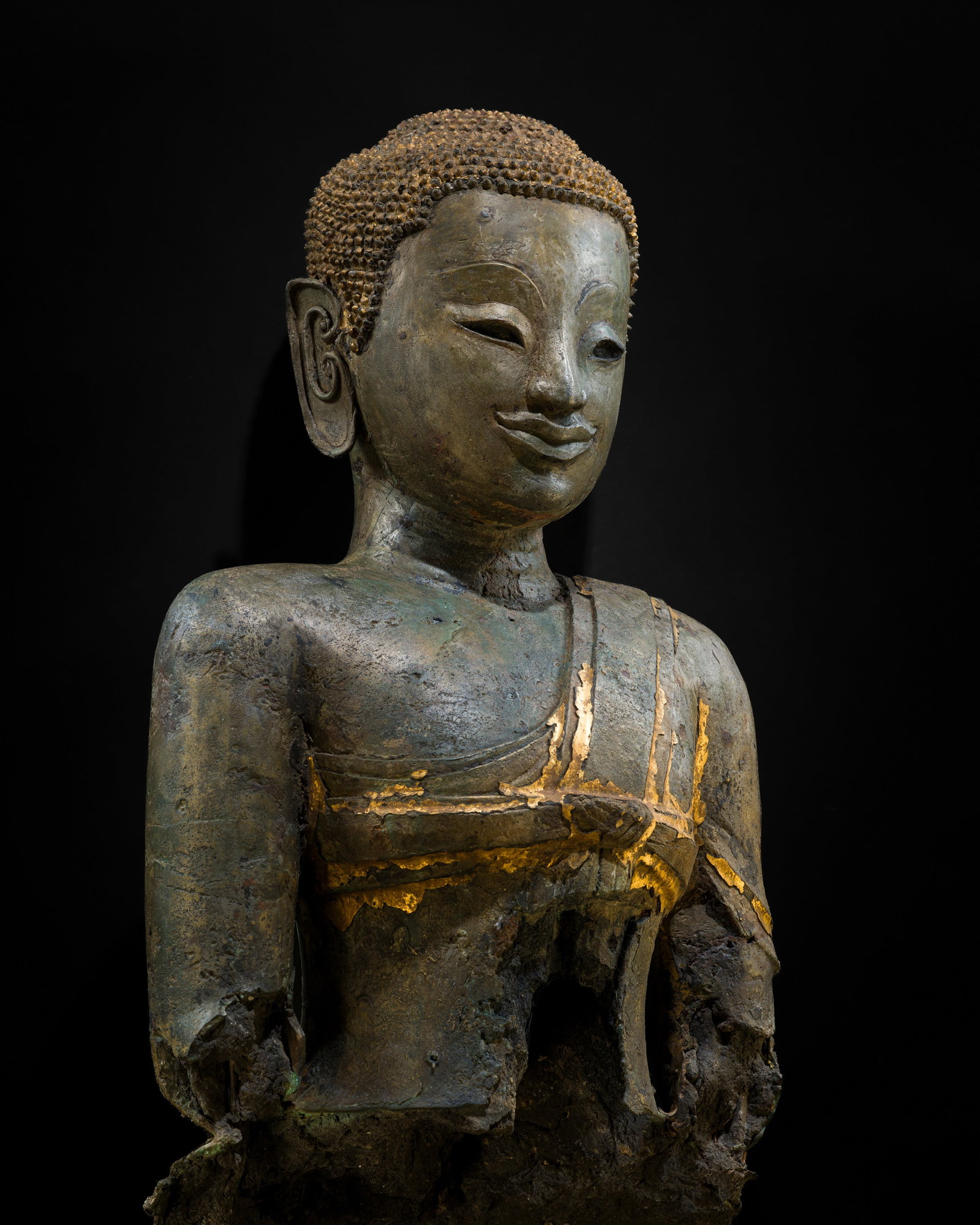 A MASSIVE LIFE-SIZE BRONZE BUST OF BUDDHA, AYUTTHAYA PERIOD, 16TH-17TH CENTURY: A MASSIVE LIFE-SIZE BRONZE BUST OF BUDDHA, AYUTTHAYA PERIOD, 16TH-17TH CENTURY This lot is from a single owner collection and is therefore offered without reserve Southern Thailand. Heavily cast with 