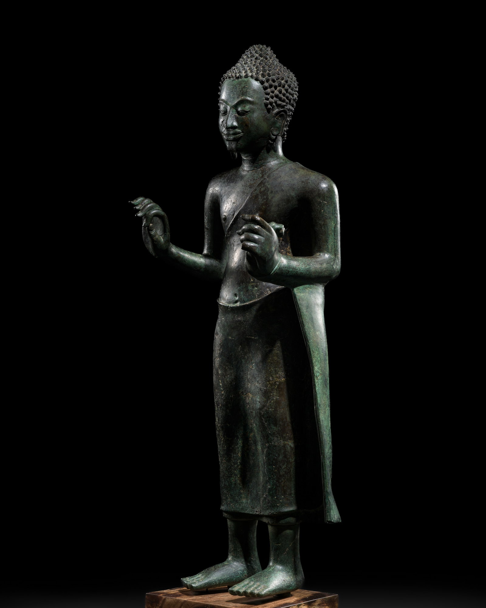 A MAGNIFICENT AND MONUMENTAL (99 CM) BRONZE FIGURE OF BUDDHA, CENTRAL THAILAND, MON-DVARAVATI: A MAGNIFICENT AND MONUMENTAL (99 CM) BRONZE FIGURE OF BUDDHA, CENTRAL THAILAND, MON-DVARAVATI PERIOD, 8TH-9TH CENTURY This lot is from a single owner collection and is therefore offered without reserv