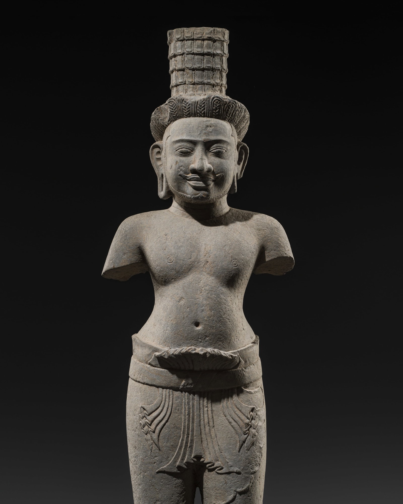 A VERY RARE KHMER SANDSTONE FIGURE OF VISHNU, BAKONG STYLE, ANGKOR PERIOD, LATE 9TH CENTURY: A VERY RARE KHMER SANDSTONE FIGURE OF VISHNU, BAKONG STYLE, ANGKOR PERIOD, LATE 9TH CENTURY This lot is from a single owner collection and is therefore offered without reserve The Jorgen Ruben Gallery