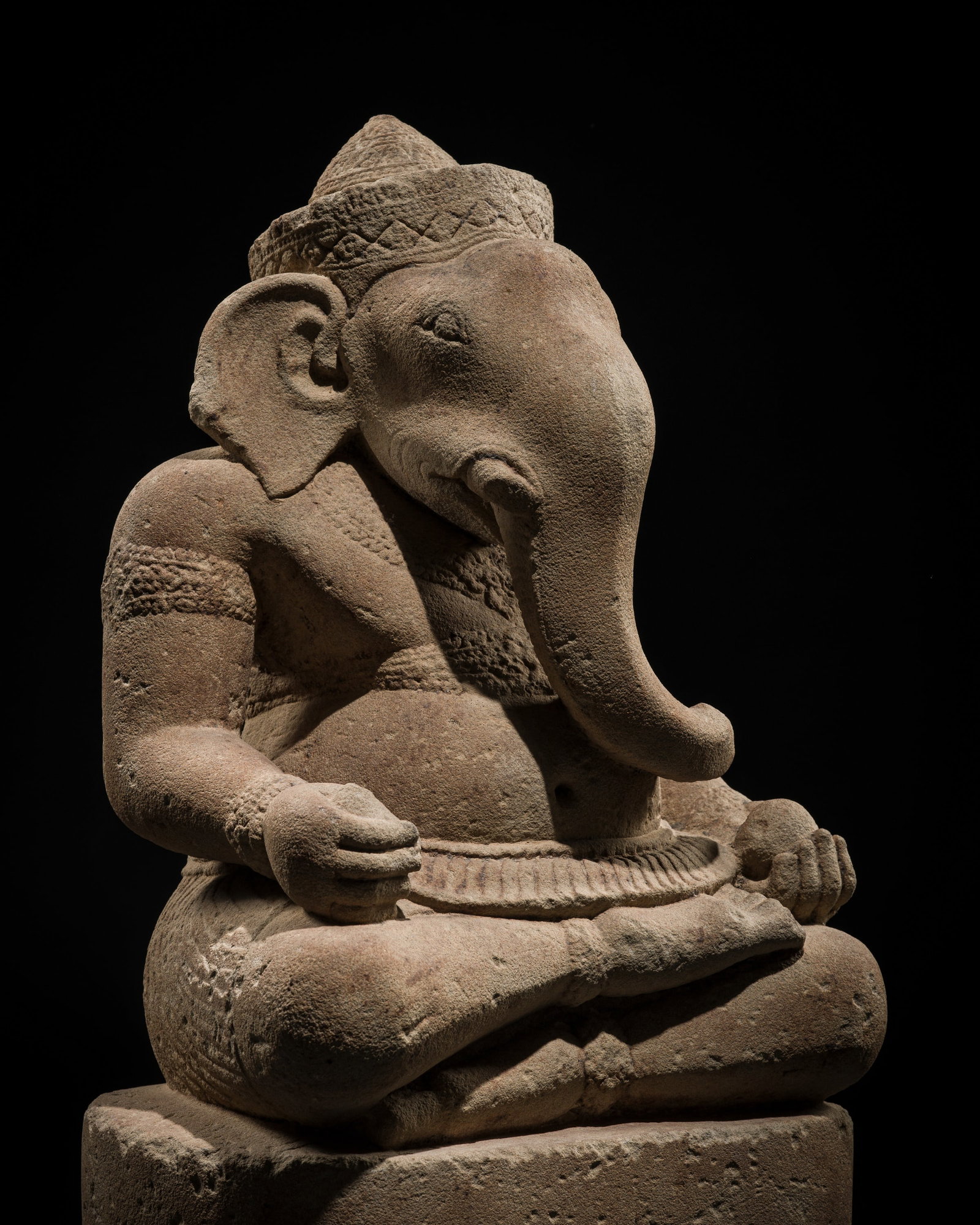 A SANDSTONE FIGURE OF GANESHA, KOH KER STYLE, ANGKOR PERIOD, 10TH CENTURY: A SANDSTONE FIGURE OF GANESHA, KOH KER STYLE, ANGKOR PERIOD, 10TH CENTURY This lot is from a single owner collection and is therefore offered without reserve The Jorgen Ruben Gallery Ledger, entry fro