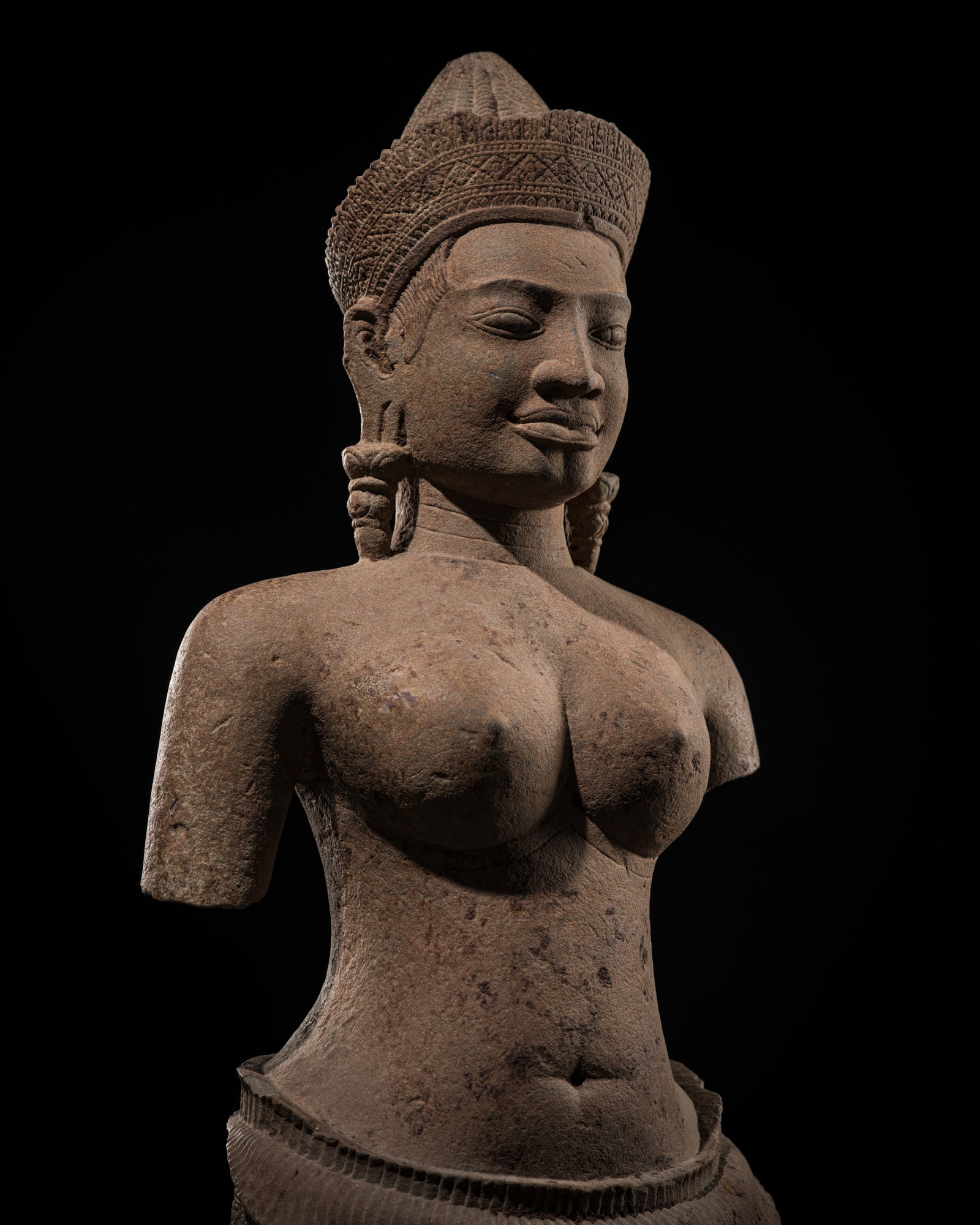 A LARGE SANDSTONE FIGURE OF UMA, BAKHENG STYLE, ANGKOR PERIOD, 10TH CENTURY: A LARGE SANDSTONE FIGURE OF UMA, BAKHENG STYLE, ANGKOR PERIOD, 10TH CENTURY This lot is from a single owner collection and is therefore offered without reserve The Jorgen Ruben Gallery Ledger, entry f