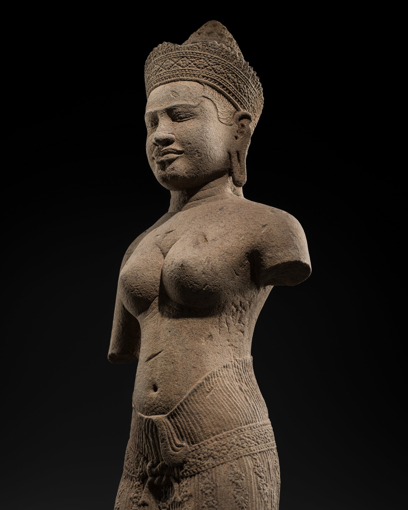 A RARE AND LARGE SANDSTONE FIGURE OF UMA, BANTEAY SREI STYLE, ANGKOR PERIOD, 10TH CENTURY: A RARE AND LARGE SANDSTONE FIGURE OF UMA, BANTEAY SREI STYLE, ANGKOR PERIOD, 10TH CENTURY This lot is from a single owner collection and is therefore offered without reserve The Jorgen Ruben Gallery L
