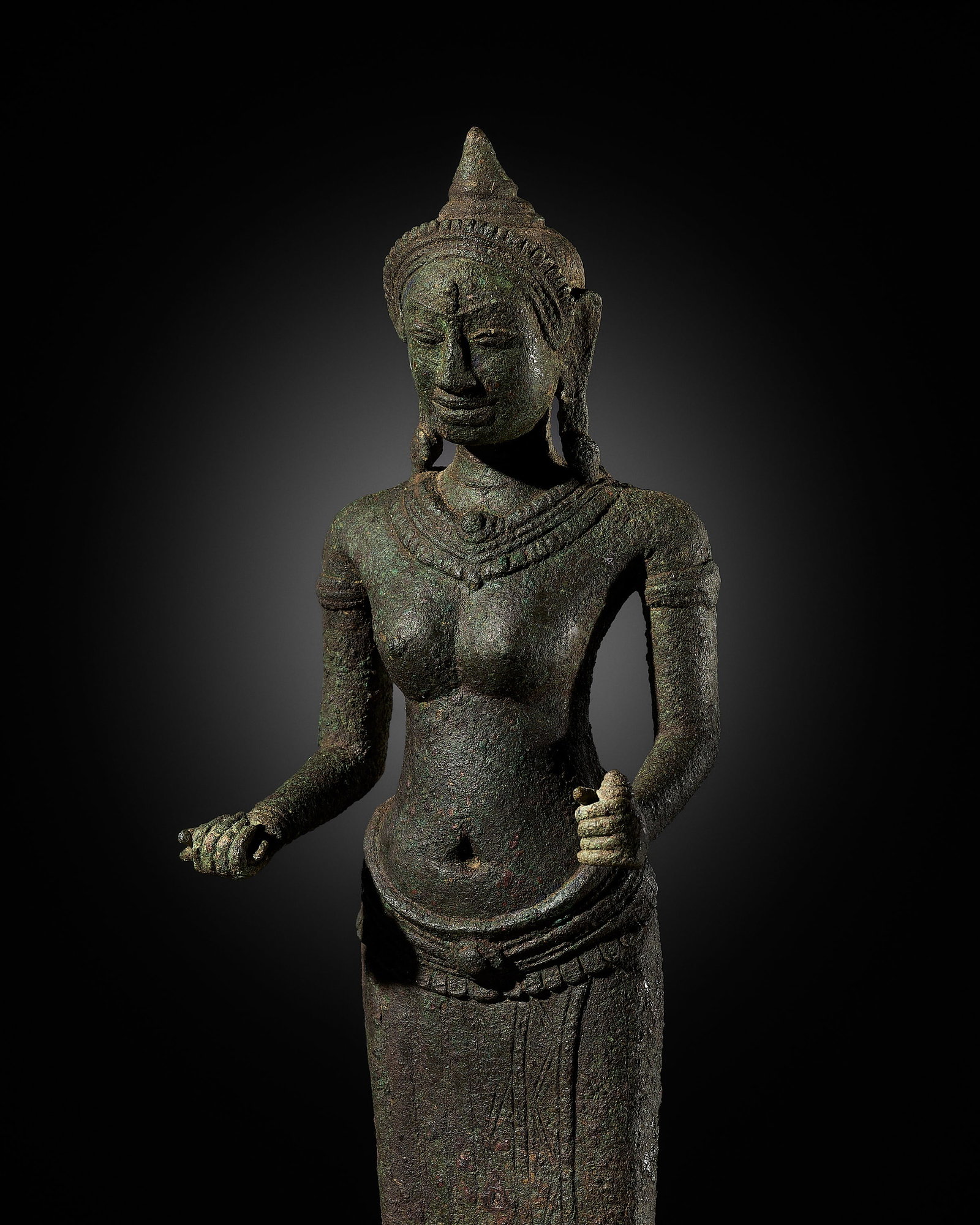 A BRONZE FIGURE OF PRAJNAPARAMITA, BAYON STYLE, ANGKOR PERIOD, 12TH-13TH CENTURY: A BRONZE FIGURE OF PRAJNAPARAMITA, BAYON STYLE, ANGKOR PERIOD, 12TH-13TH CENTURY This lot is from a single owner collection and is therefore offered without reserve The Jorgen Ruben Gallery Ledger, en