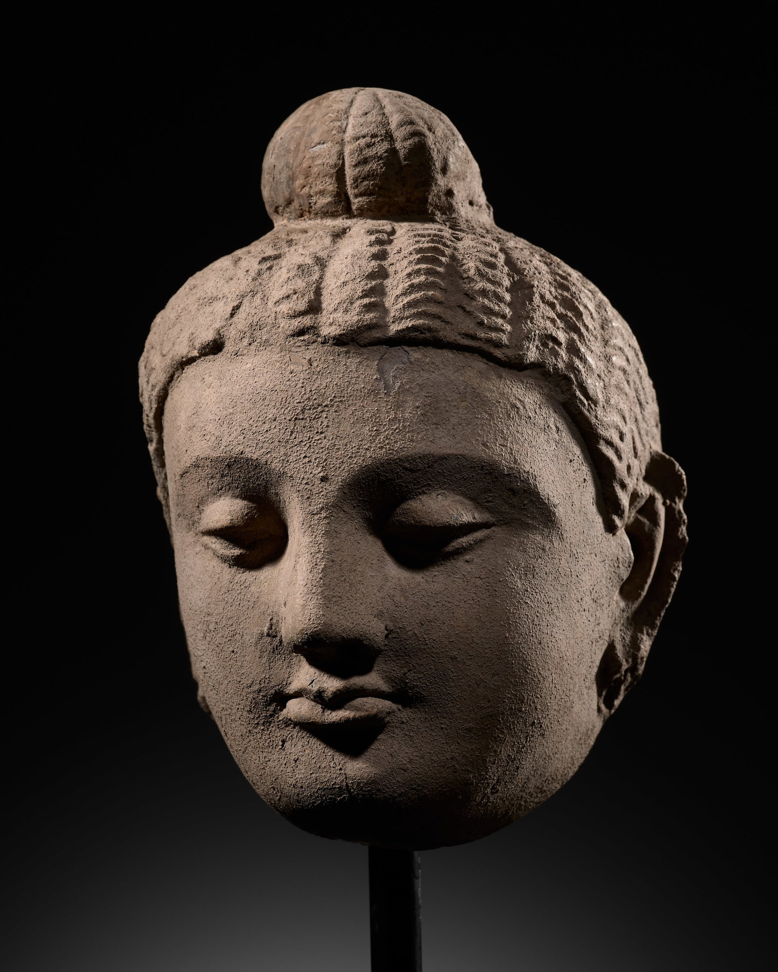 A FINE STUCCO HEAD OF BUDDHA, ANCIENT REGION OF GANDHARA, 3RD-4TH CENTURY: A FINE STUCCO HEAD OF BUDDHA, ANCIENT REGION OF GANDHARA, 3RD-4TH CENTURY This lot is from a single owner collection and is therefore offered without reserve The Jorgen Ruben Gallery Ledger, entry fro