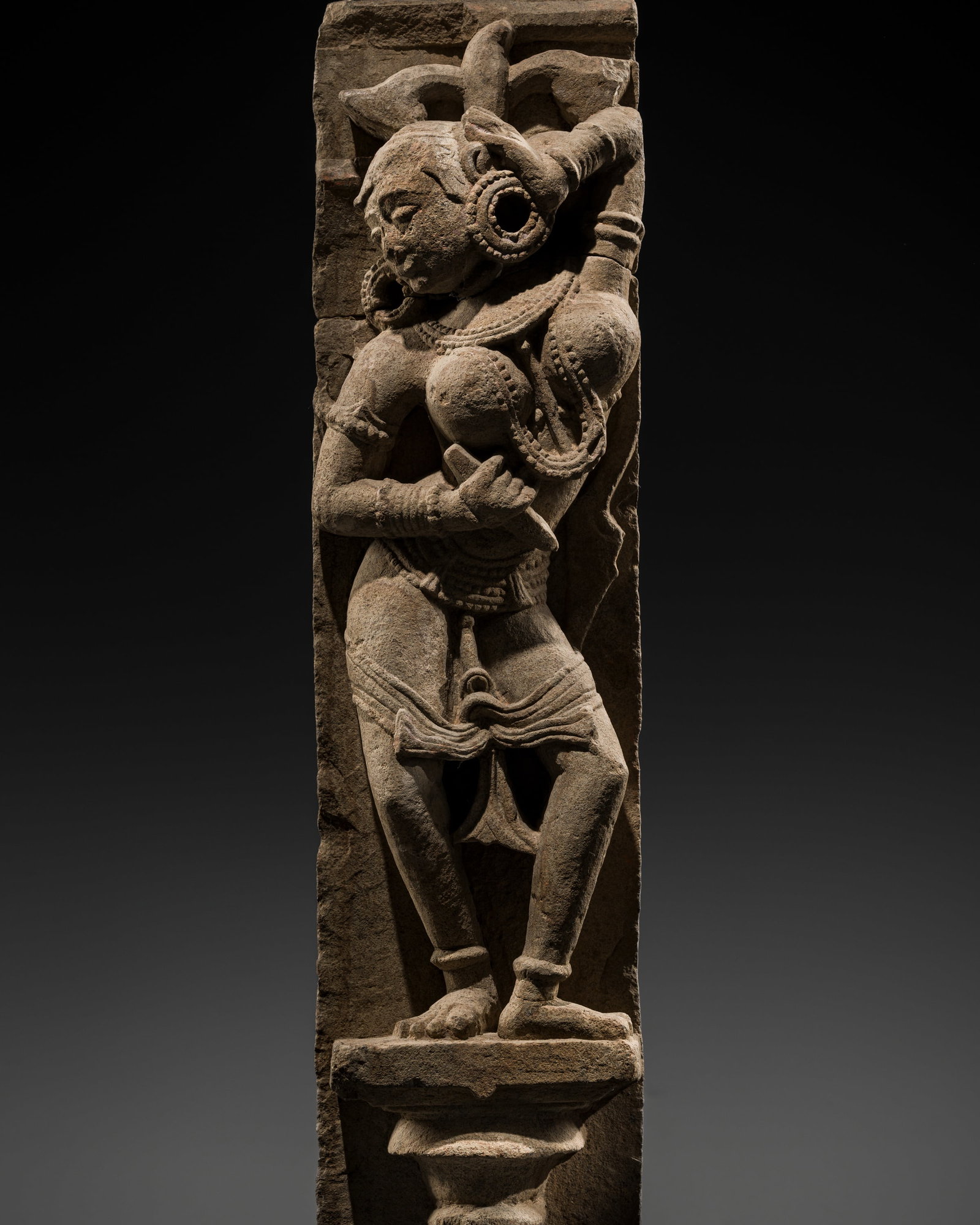 A RED SANDSTONE FIGURE OF A CELESTIAL BEAUTY, SURASUNDARI, CENTRAL INDIA, CHANDELA DYNASTY,: A RED SANDSTONE FIGURE OF A CELESTIAL BEAUTY, SURASUNDARI, CENTRAL INDIA, CHANDELA DYNASTY, 10TH-11TH CENTURY This lot is from a single owner collection and is therefore offered without reserve The Jo