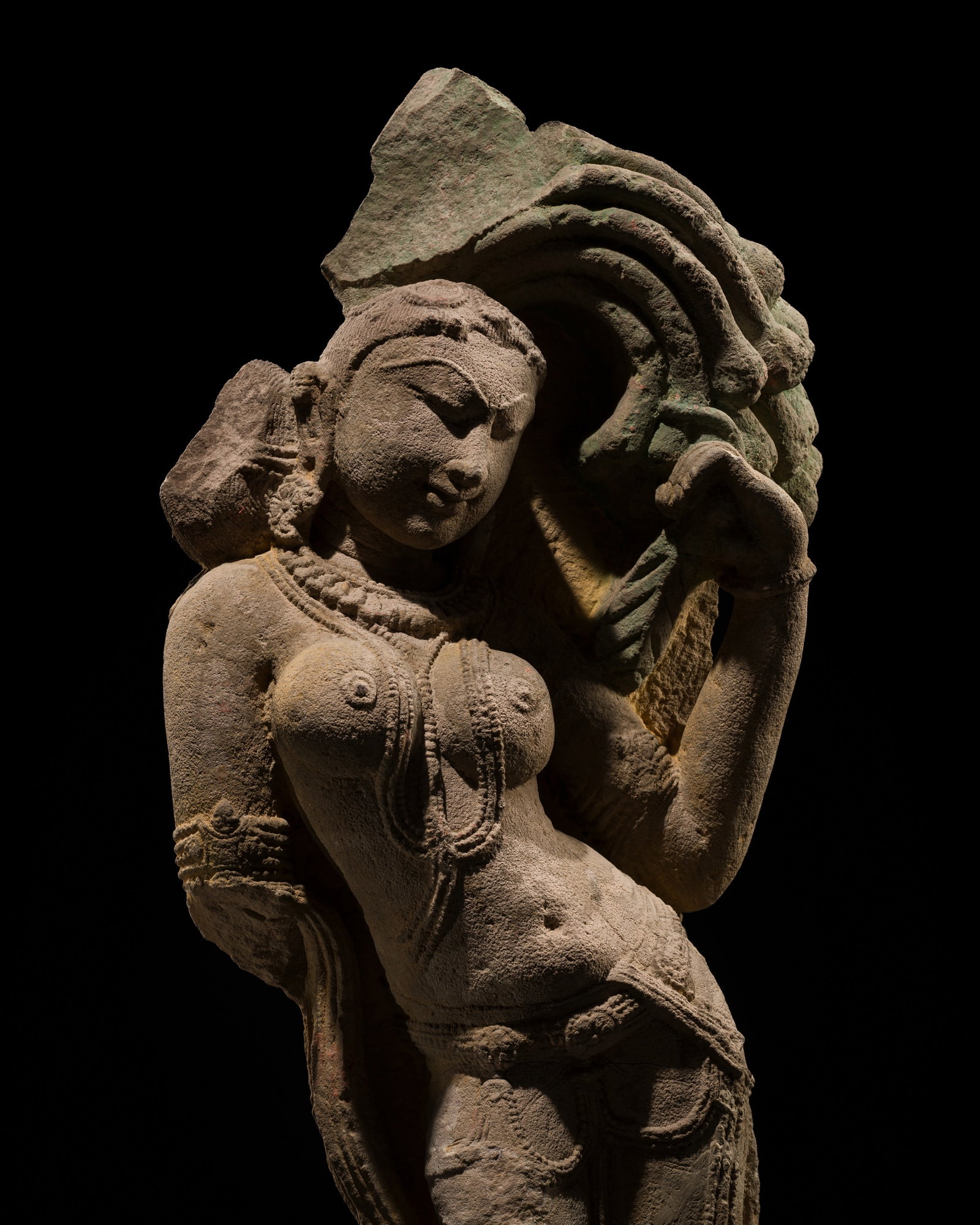 A RED SANDSTONE FIGURE OF A CELESTIAL BEAUTY, SURASUNDARI, RAJASTHAN OR MADHYA PRADESH, 11TH CENTURY: A RED SANDSTONE FIGURE OF A CELESTIAL BEAUTY, SURASUNDARI, RAJASTHAN OR MADHYA PRADESH, 11TH CENTURY This lot is from a single owner collection and is therefore offered without reserve The Jorgen Rube