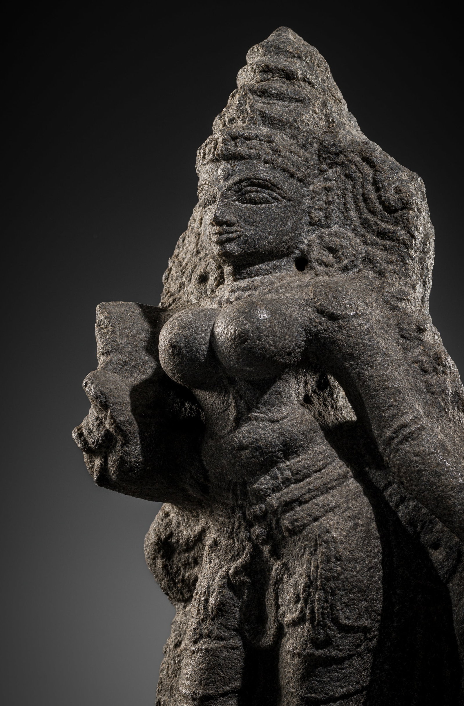 A GRANITE FIGURE OF BHUDEVI, LATE CHOLA-EARLY VIJAYANAGARA PERIOD, 13TH-14TH CENTURY: A GRANITE FIGURE OF BHUDEVI, LATE CHOLA-EARLY VIJAYANAGARA PERIOD, 13TH-14TH CENTURY This lot is from a single owner collection and is therefore offered without reserve The Jorgen Ruben Gallery Ledger