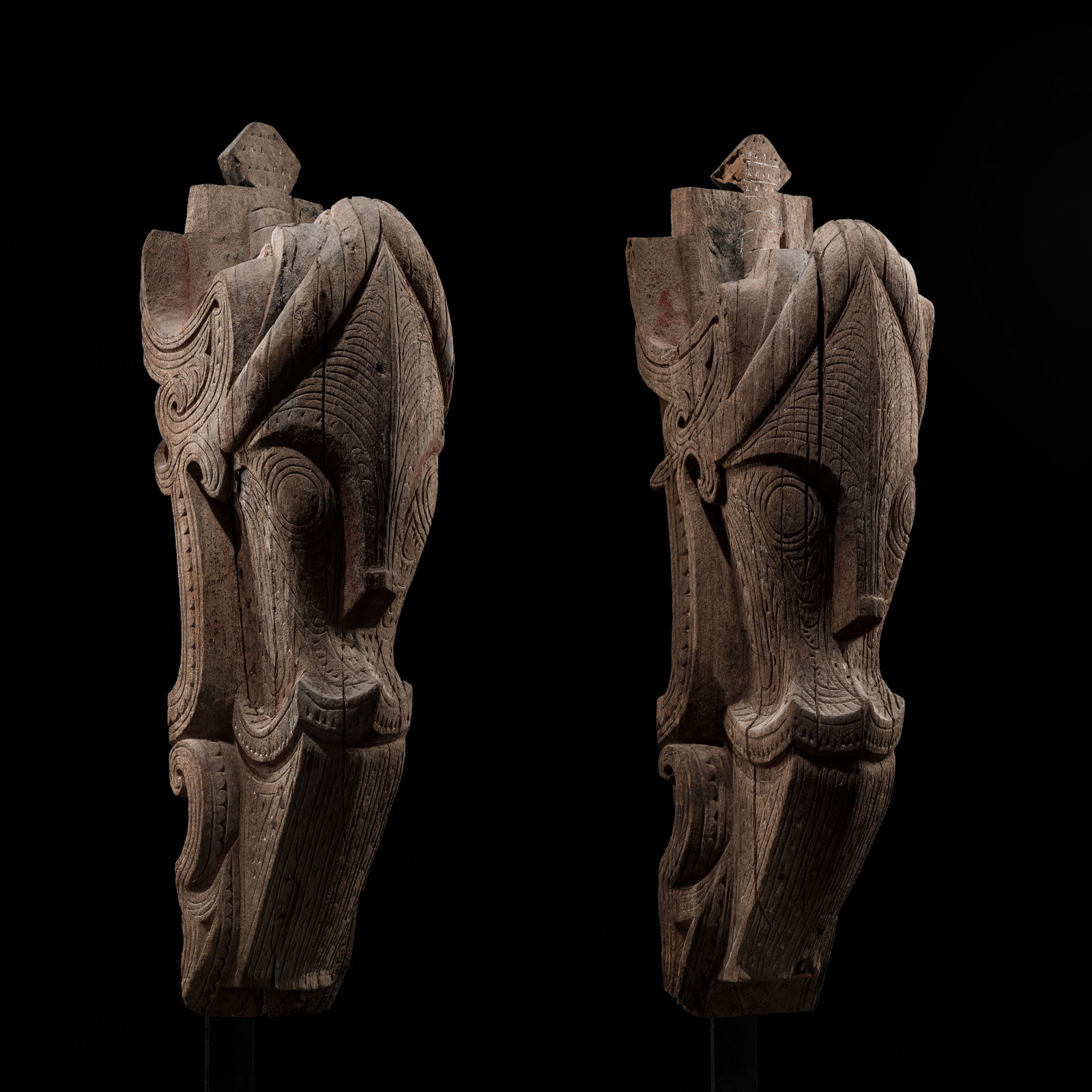 A PAIR OF IMPOSING WOOD 'SINGA HEAD' ARCHITECTURAL ORNAMENTS, SUMATRA, TOBA BATAK PEOPLE, LATE: A PAIR OF IMPOSING WOOD 'SINGA HEAD' ARCHITECTURAL ORNAMENTS, SUMATRA, TOBA BATAK PEOPLE, LATE 19TH-EARLY 20TH CENTURY This lot is from a single owner collection and is therefore offered without reser