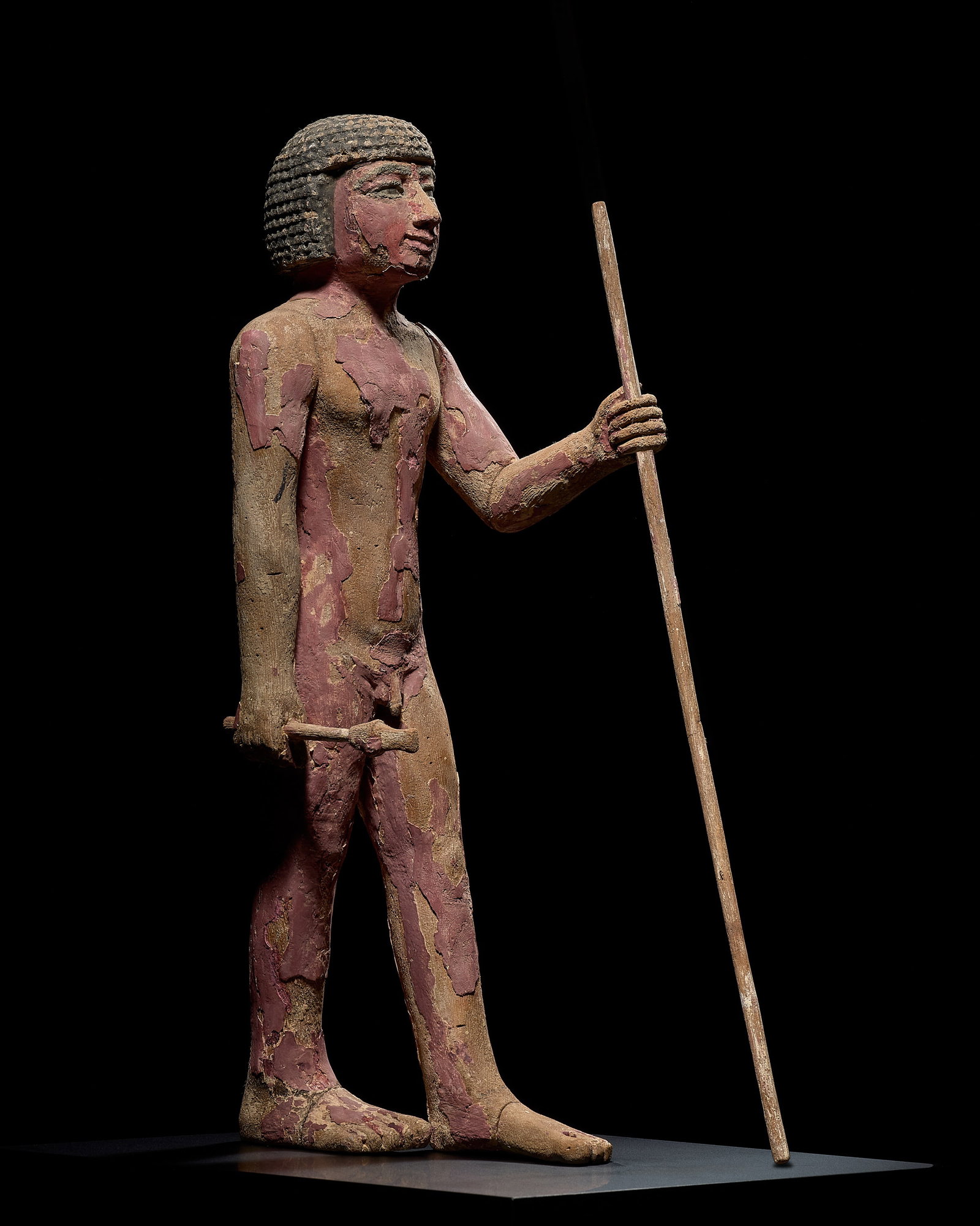 A SUPERB EGYPTIAN PAINTED WOOD FIGURE OF THE SEAL BEARER TJETJI, OLD KINGDOM, DYNASTY VI: A SUPERB EGYPTIAN PAINTED WOOD FIGURE OF THE SEAL BEARER TJETJI, OLD KINGDOM, DYNASTY VI This lot is from a single owner collection and is therefore offered without reserve The Jorgen Ruben Gallery Le