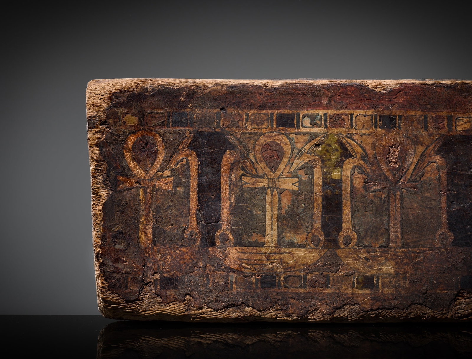 AN EGYPTIAN POLYCHROME WOOD 'ANKH AND WAS' SARCOPHAGUS FRAGMENT, LATE PERIOD-PTOLEMAIC PERIOD: AN EGYPTIAN POLYCHROME WOOD 'ANKH AND WAS' SARCOPHAGUS FRAGMENT, LATE PERIOD-PTOLEMAIC PERIOD This lot is from a single owner collection and is therefore offered without reserve Egypt, 664-30 BC. Fine