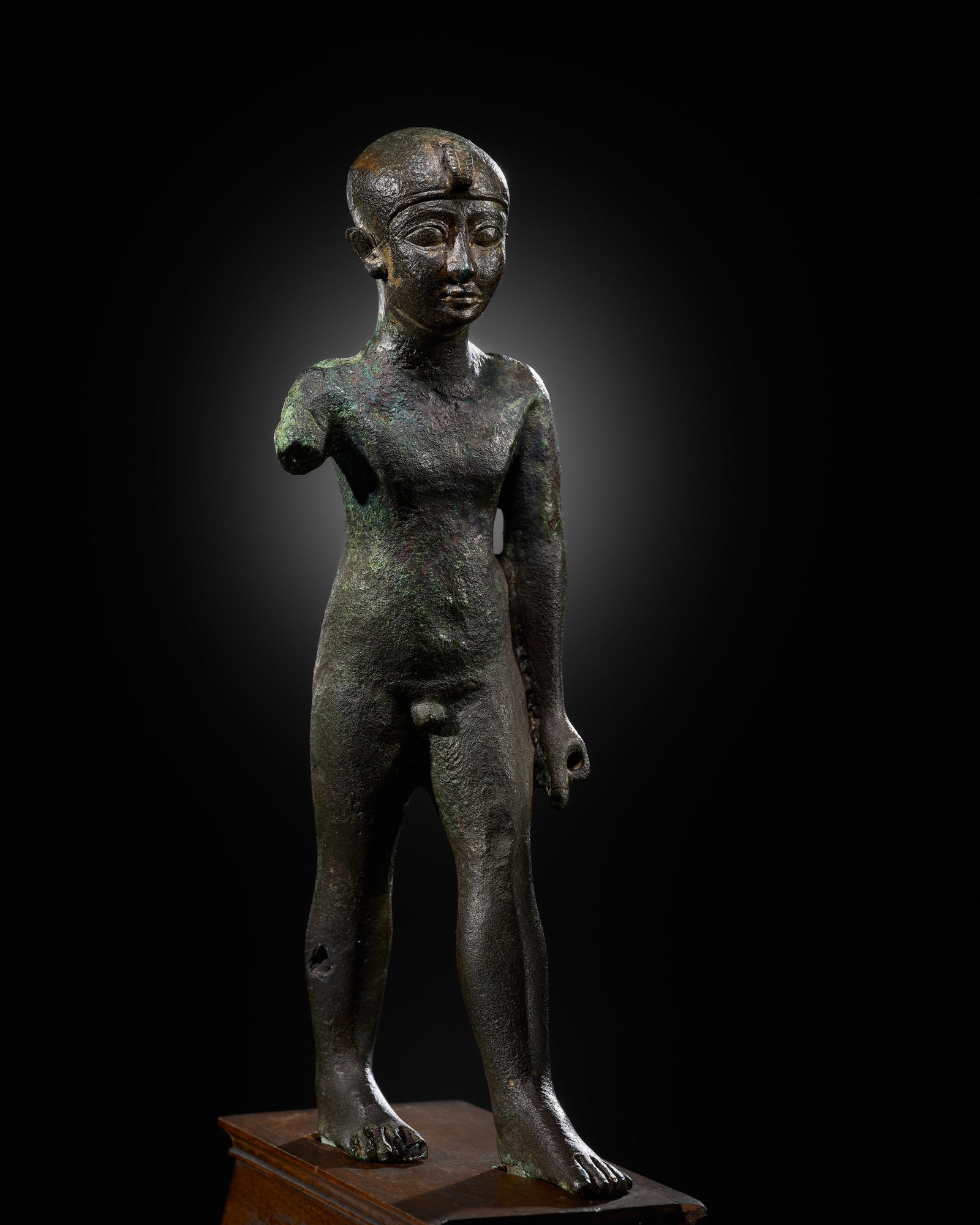 AN EGYPTIAN BRONZE FIGURE OF A PRIEST, LATE PERIOD: AN EGYPTIAN BRONZE FIGURE OF A PRIEST, LATE PERIOD This lot is from a single owner collection and is therefore offered without reserve The Jorgen Ruben Gallery Ledger, entry from 2005: “No. 67, 