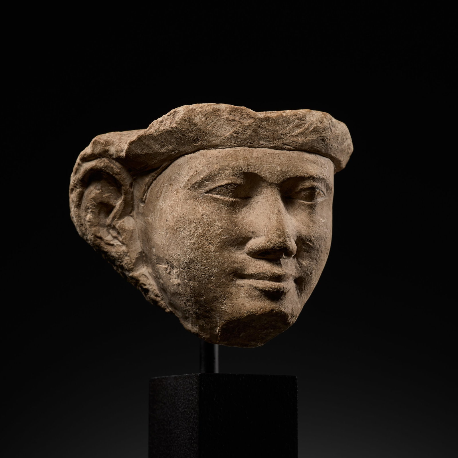 AN EGYPTIAN LIMESTONE HEAD OF AN OFFICIAL, DYNASTY XXV-XXVI (1 of 17)