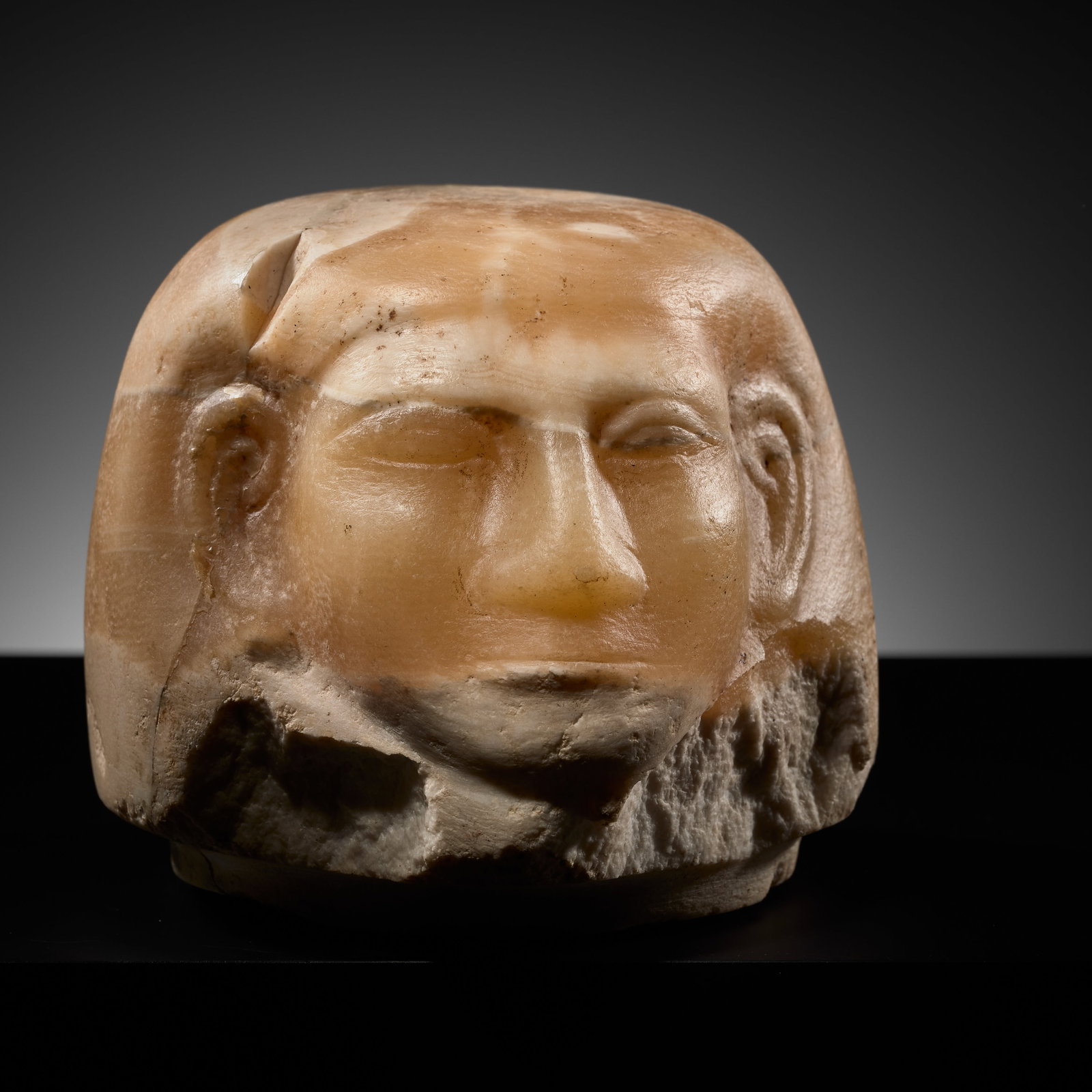 AN EGYPTIAN BANDED ALABASTER 'IMSETY' CANOPIC JAR HEAD, MIDDLE KINGDOM, DYNASTY XII (1 of 15)