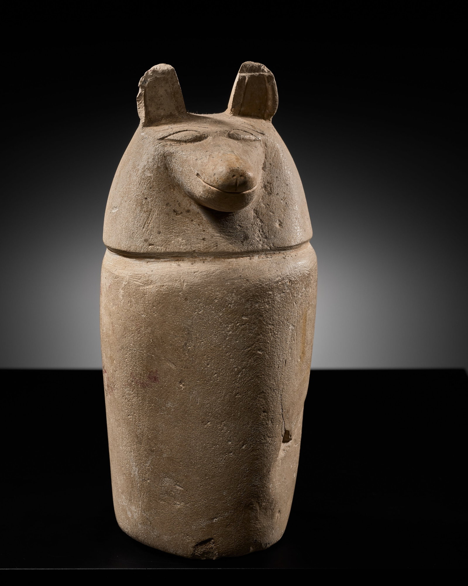 AN EGYPTIAN LIMESTONE 'DUAMUTEF' DUMMY CANOPIC JAR, THIRD INTERMEDIATE PERIOD (1 of 15)