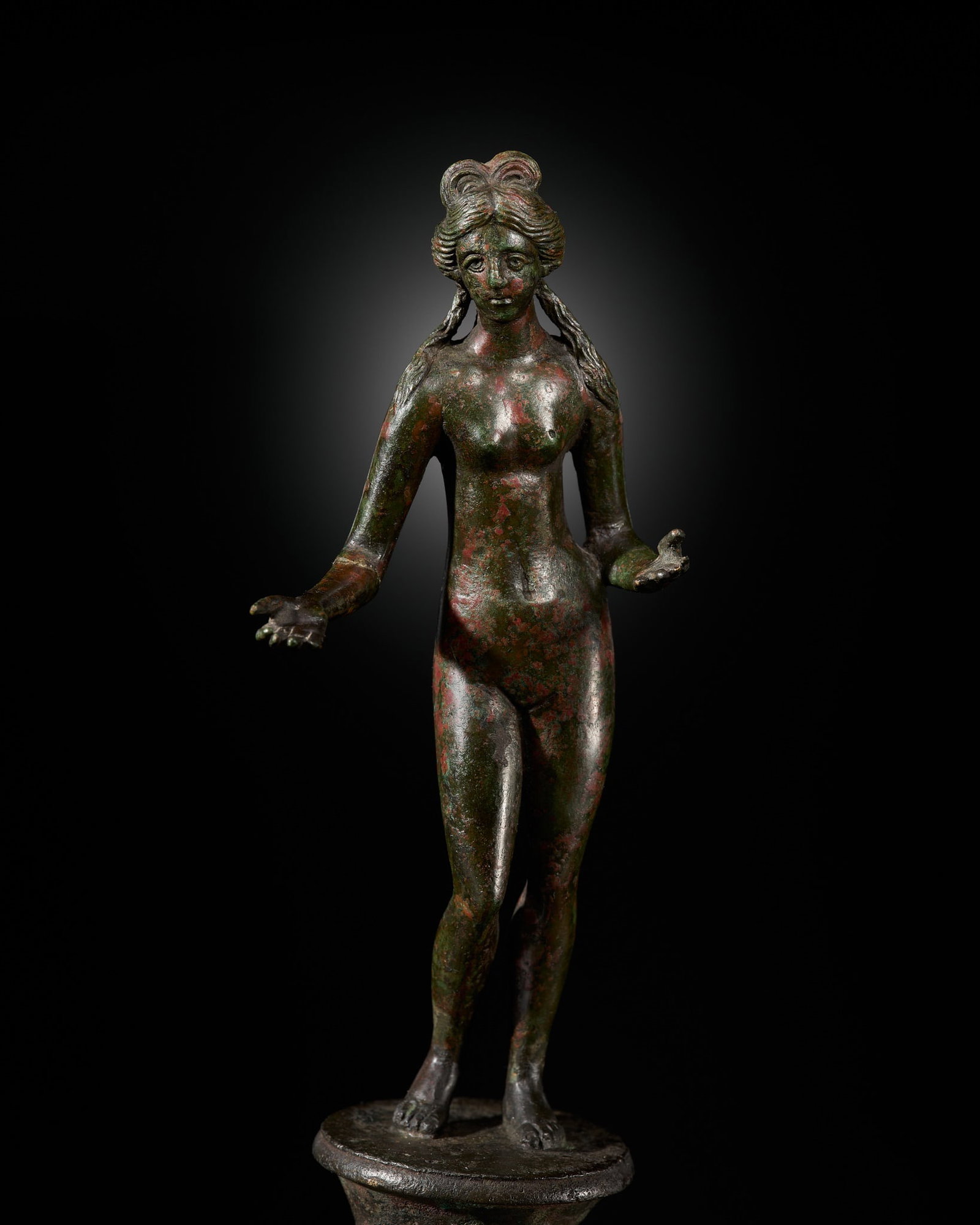 A ROMAN BRONZE FIGURE OF VENUS, CIRCA 1ST-2ND CENTURY: A ROMAN BRONZE FIGURE OF VENUS, CIRCA 1ST-2ND CENTURY This lot is from a single owner collection and is therefore offered without reserve The Jorgen Ruben Gallery Ledger, entry from 2012: “No. 7
