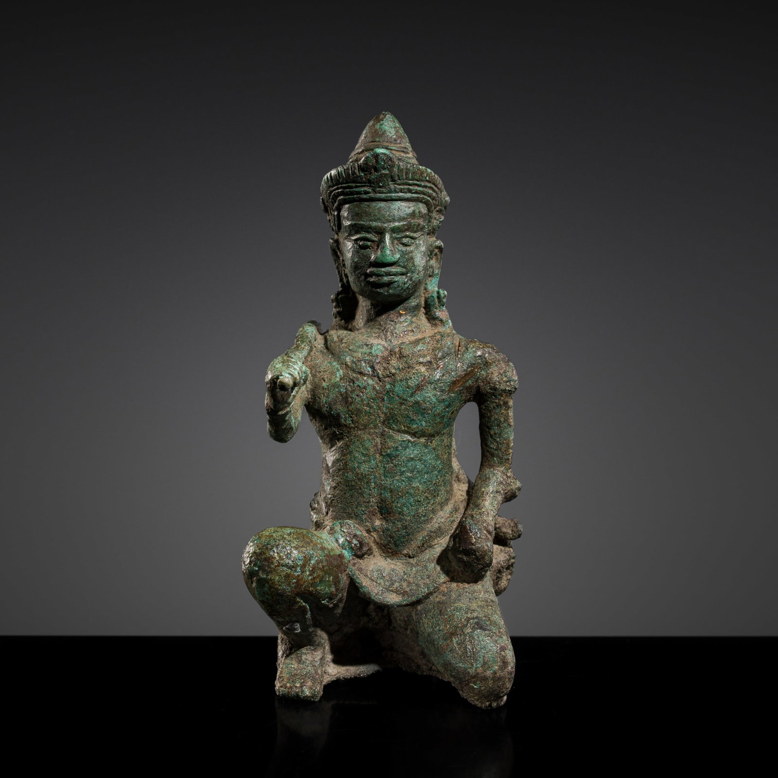 A SMALL BRONZE FIGURE OF VISHVAKARMAN, ANGKOR WAT STYLE, 12TH CENTURY: A SMALL BRONZE FIGURE OF VISHVAKARMAN, ANGKOR WAT STYLE, 12TH CENTURY This lot is from a single owner collection and is therefore offered without reserve The Jorgen Ruben Gallery Ledger, entry from 20