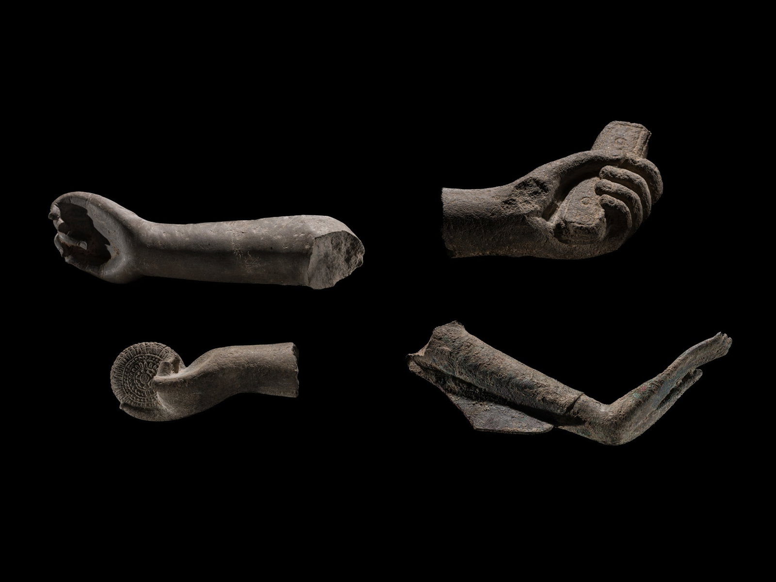 A GROUP OF ONE SUKHOTHAI BRONZE AND THREE KHMER SANDSTONE HANDS: A GROUP OF ONE SUKHOTHAI BRONZE AND THREE KHMER SANDSTONE HANDS This lot is from a single owner collection and is therefore offered without reserve The Jorgen Ruben Gallery Ledger, entry from 2012: &#